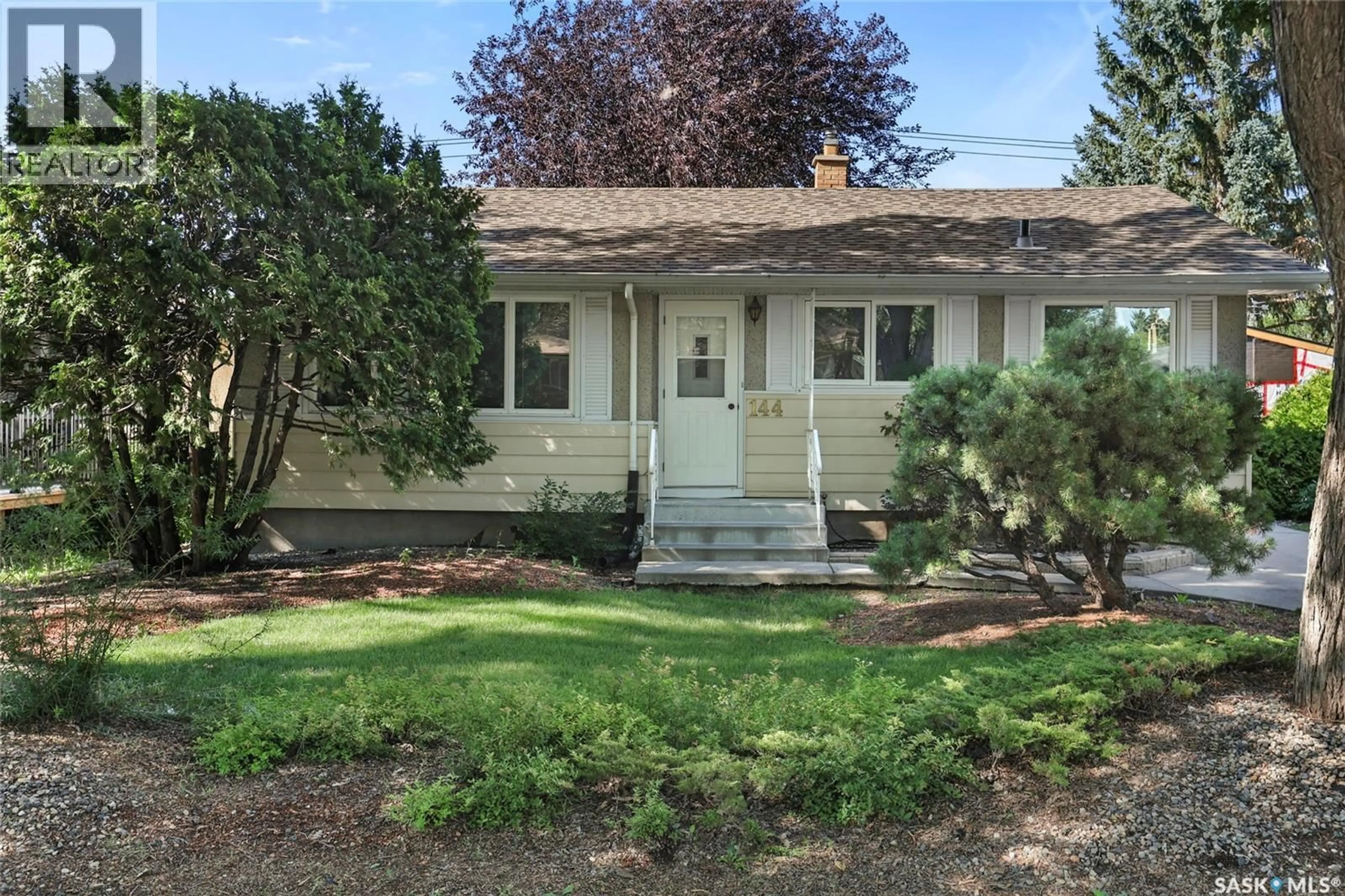 Home with vinyl exterior material, street for 144 WOODWARD AVENUE, Regina Saskatchewan S4R3H4