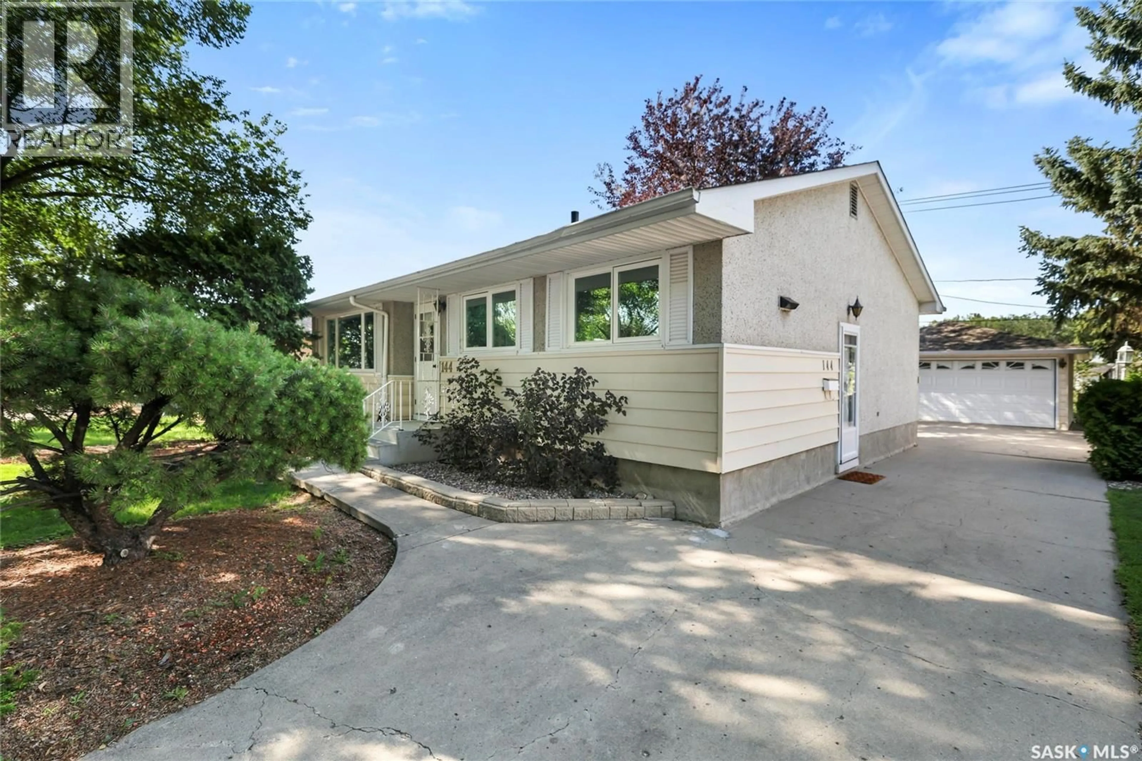 Home with vinyl exterior material, street for 144 WOODWARD AVENUE, Regina Saskatchewan S4R3H4