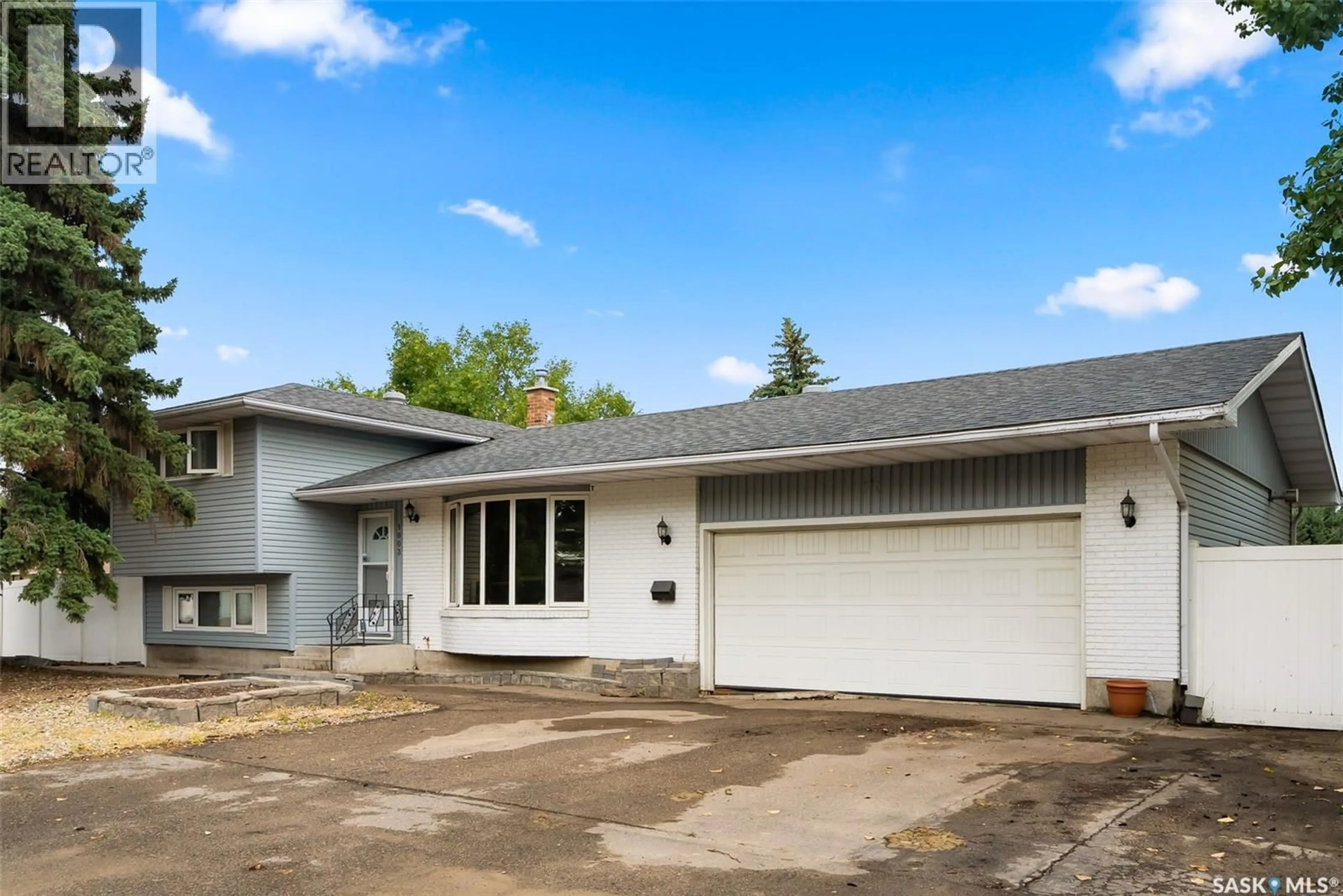 Home with vinyl exterior material, street for 1003 BROAD STREET, Regina Saskatchewan S4R6V2