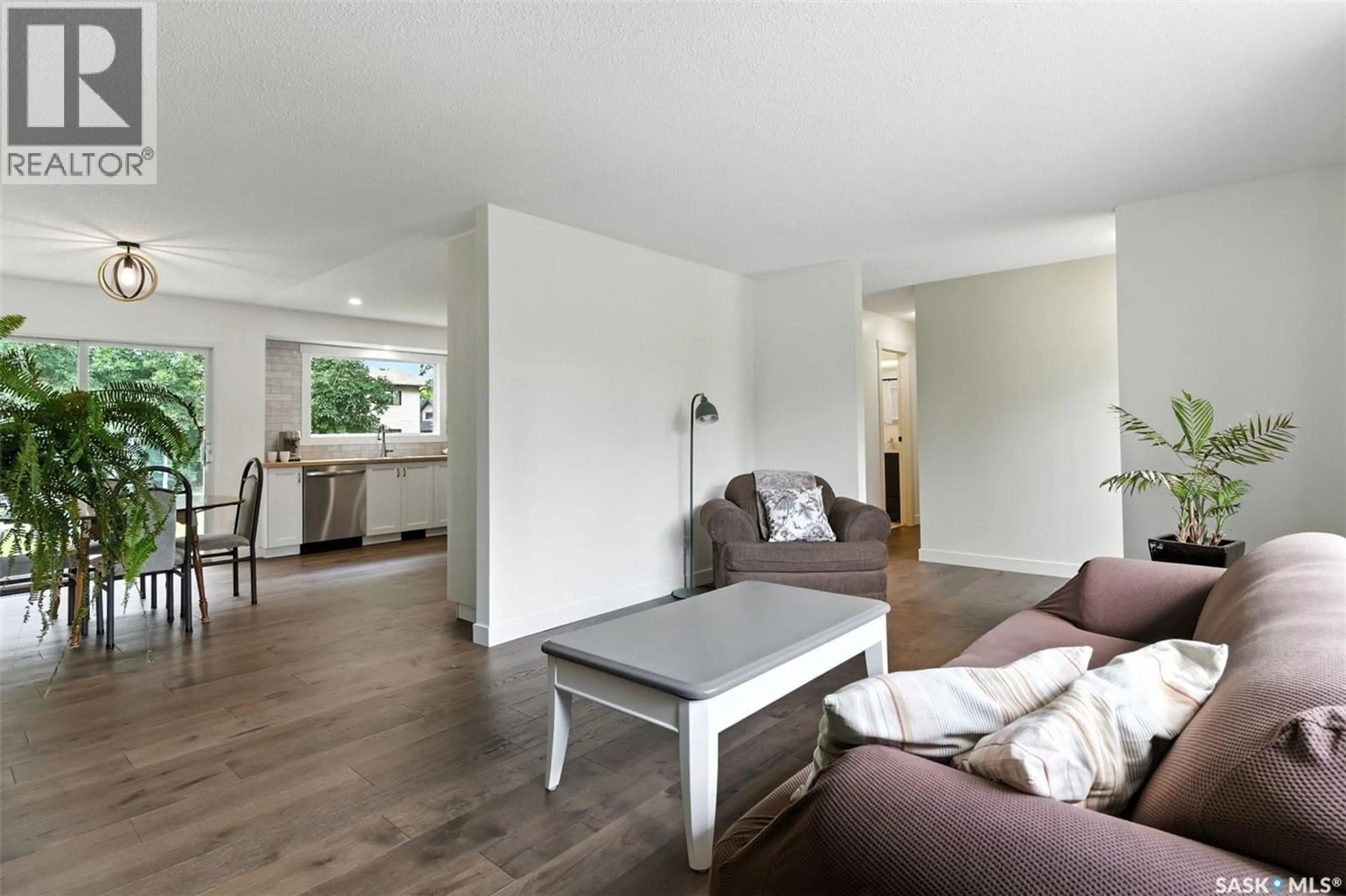 Living room with furniture, wood/laminate floor for 385 BIRCH CRESCENT, Saskatoon Saskatchewan S7N2M6