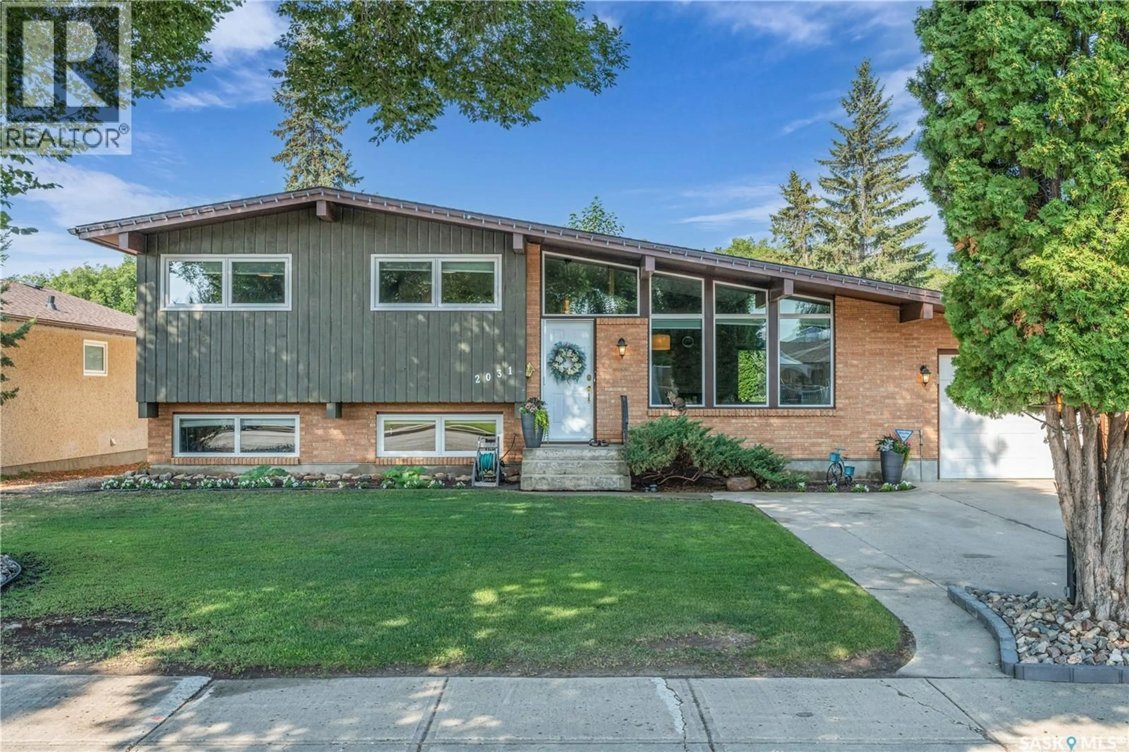 Home with brick exterior material, street for 2031 97TH STREET, North Battleford Saskatchewan S9A0L2