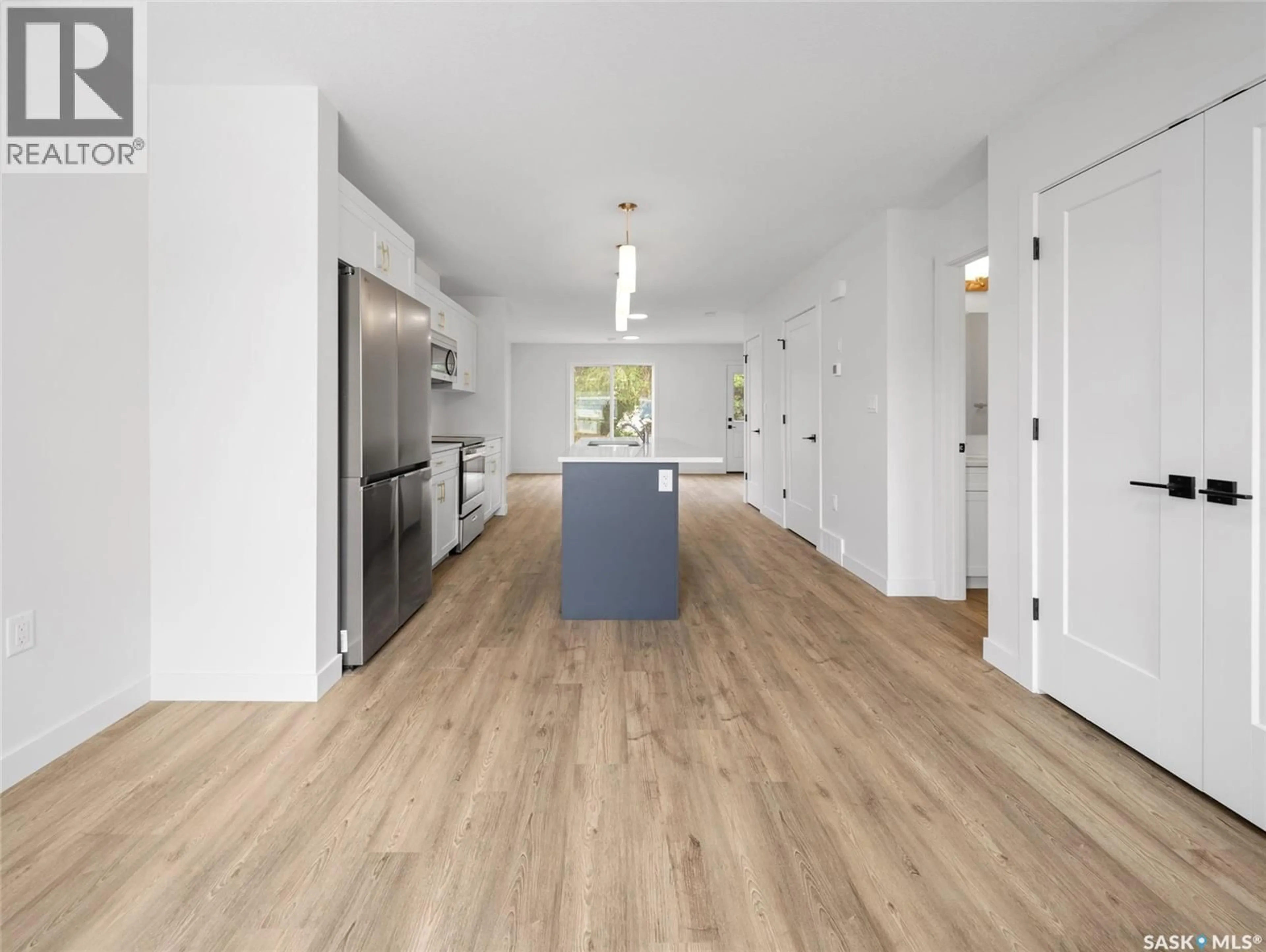 Open concept kitchen, wood/laminate floor for A/B 75 - 1 3RD AVENUE, Lumsden Saskatchewan S0G3C0