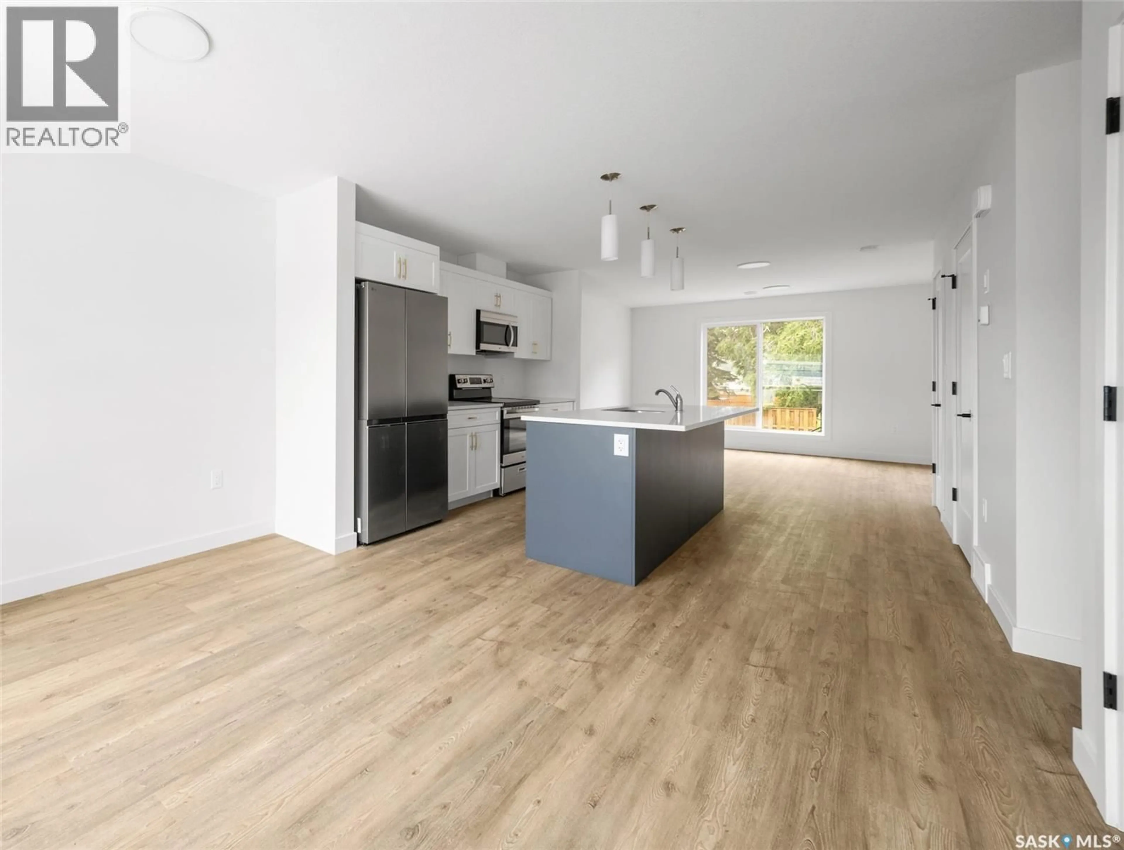 Open concept kitchen, wood/laminate floor for A/B 75 - 1 3RD AVENUE, Lumsden Saskatchewan S0G3C0