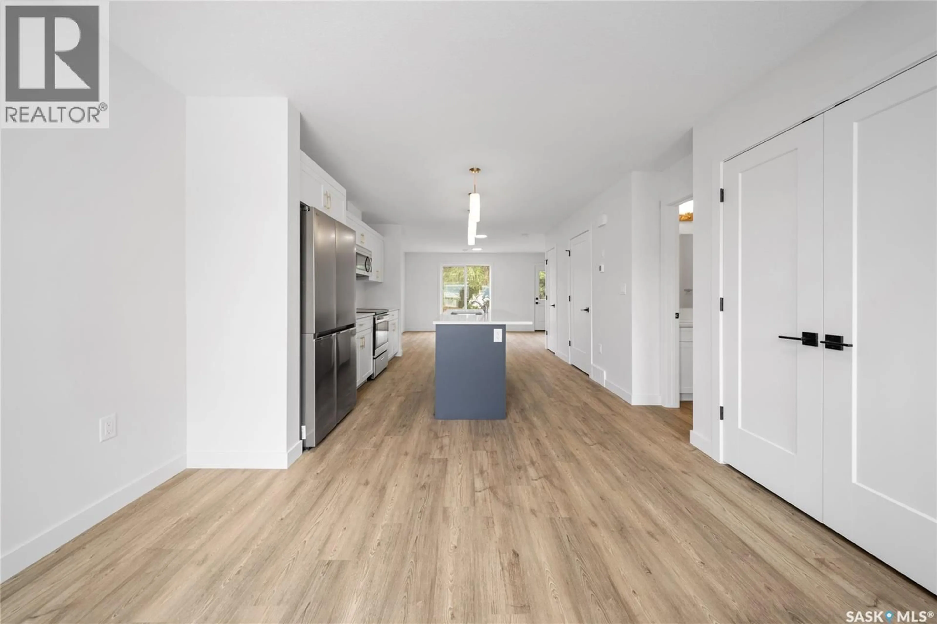 Open concept kitchen, wood/laminate floor for A/B 75 - 2 3RD AVENUE, Lumsden Saskatchewan S0G3C0
