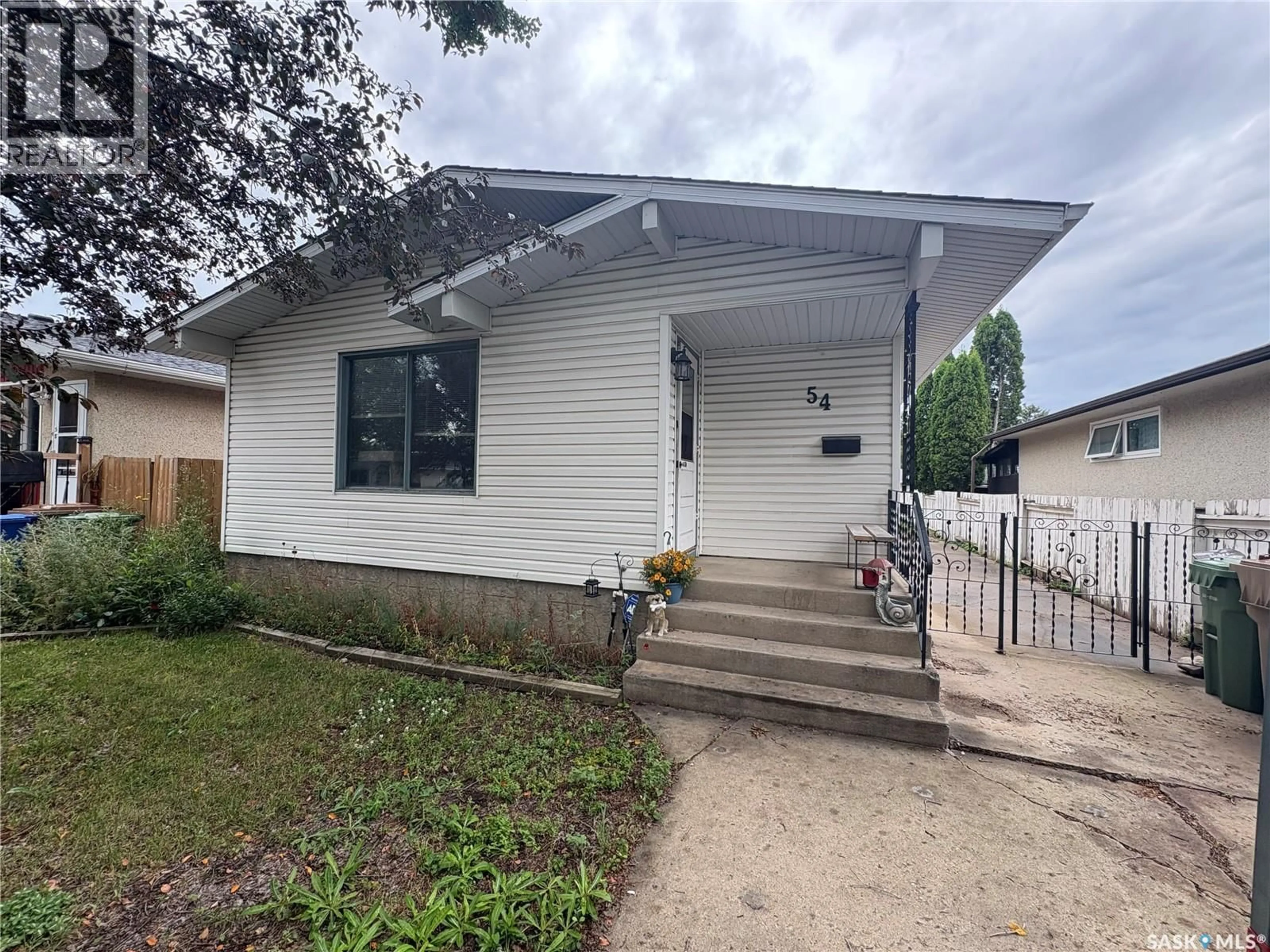 Home with vinyl exterior material, street for 54 COOPER CRESCENT, Regina Saskatchewan S4R4J7