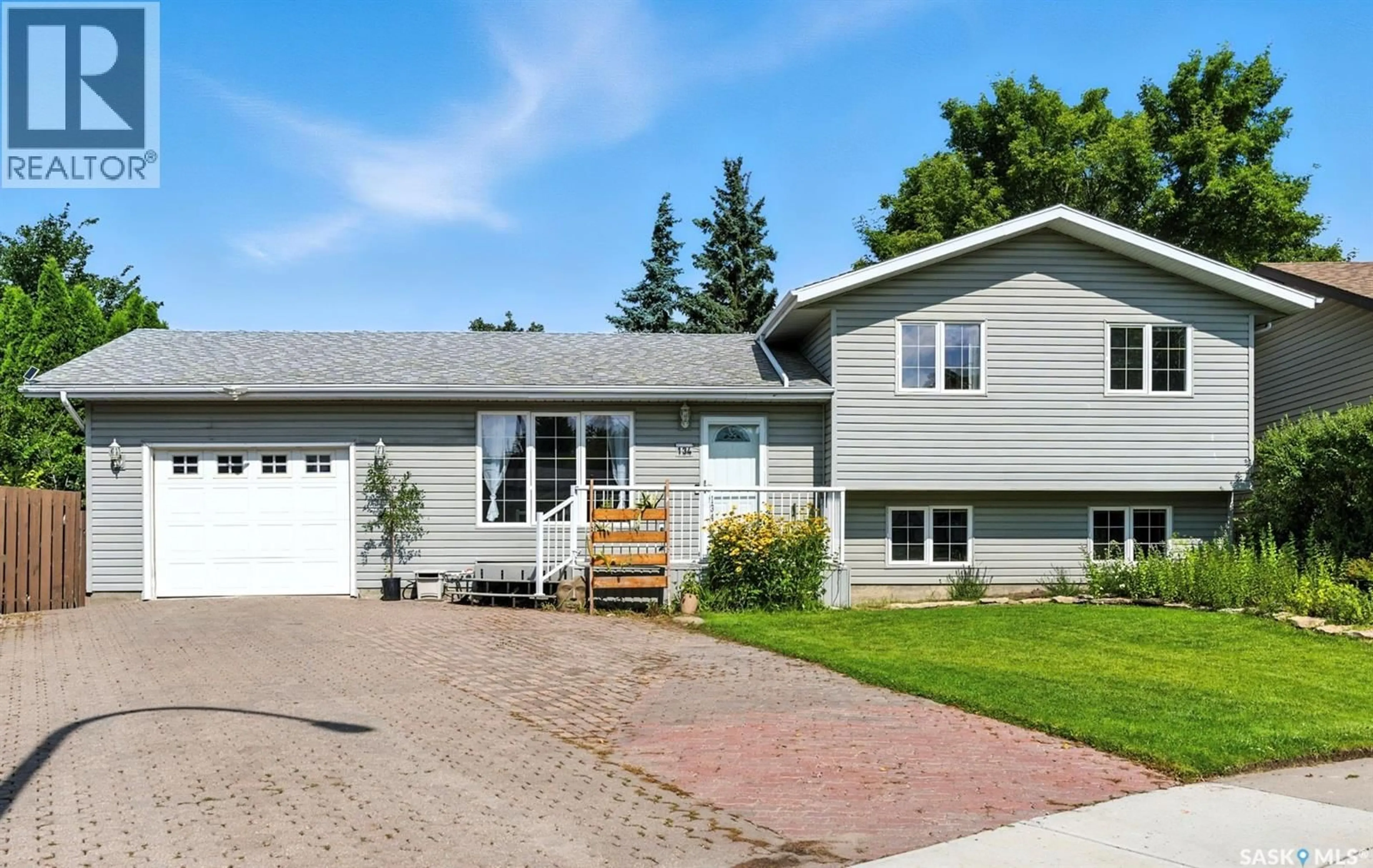 Home with vinyl exterior material, street for 134 DELAYEN CRESCENT, Saskatoon Saskatchewan S7N2V6