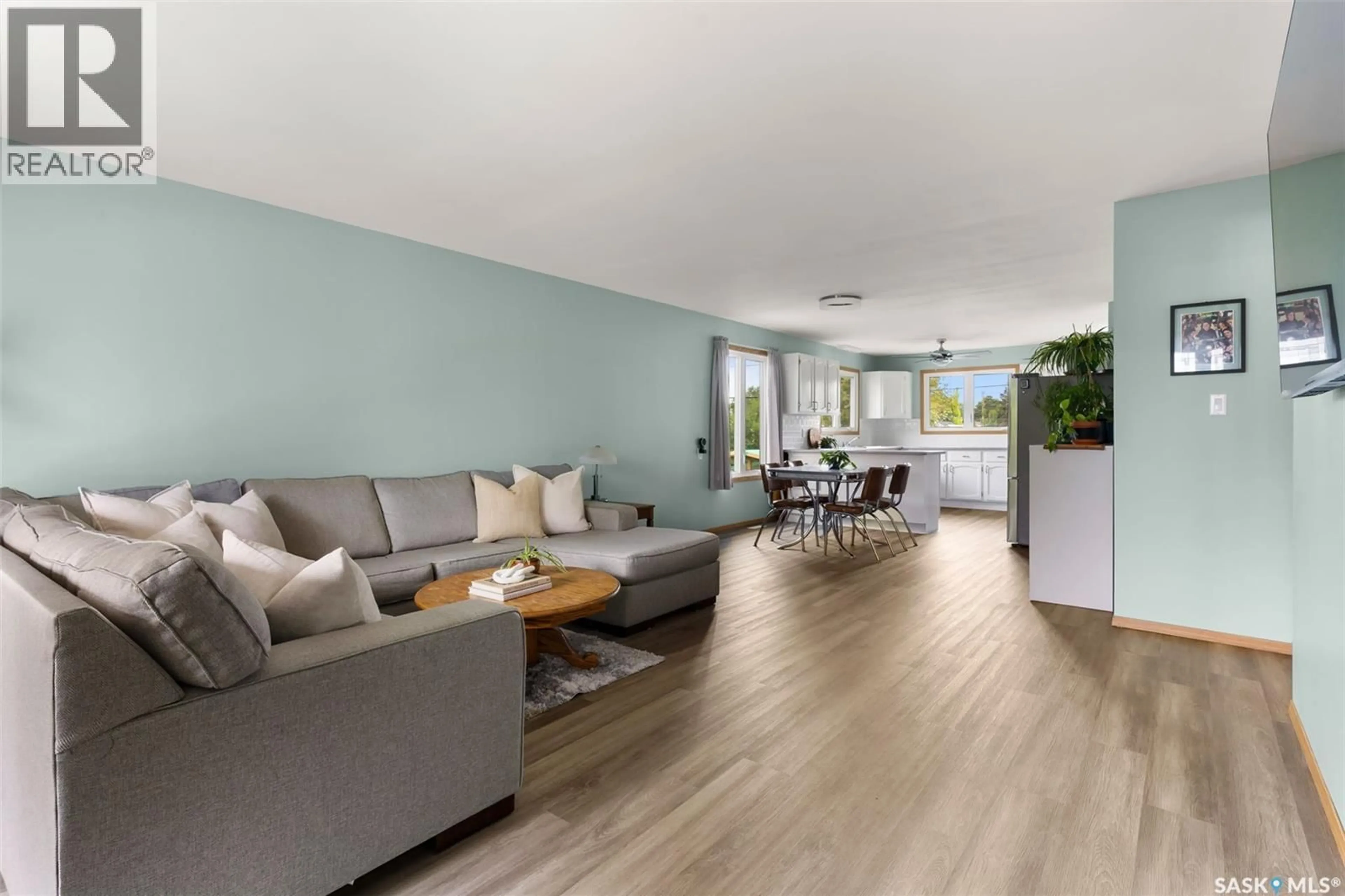 Living room with furniture, wood/laminate floor for 265 BROWNING STREET, Southey Saskatchewan S0G4P0