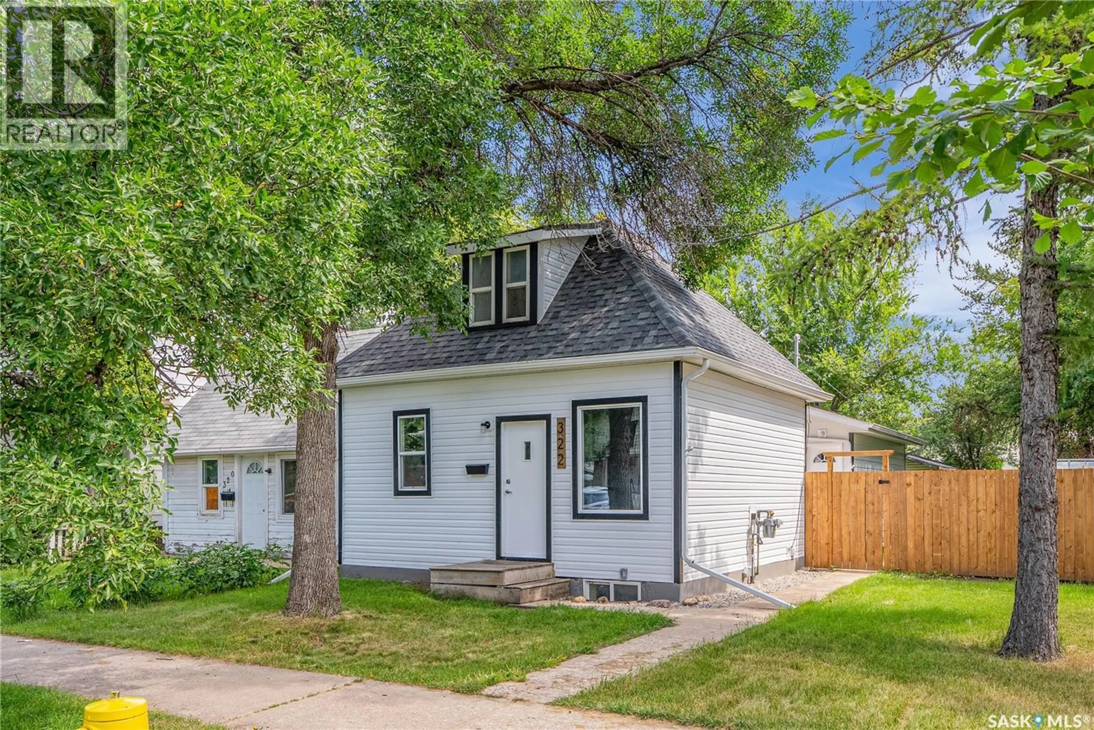 Home with vinyl exterior material, street for 322 S AVENUE S, Saskatoon Saskatchewan S7M3A2