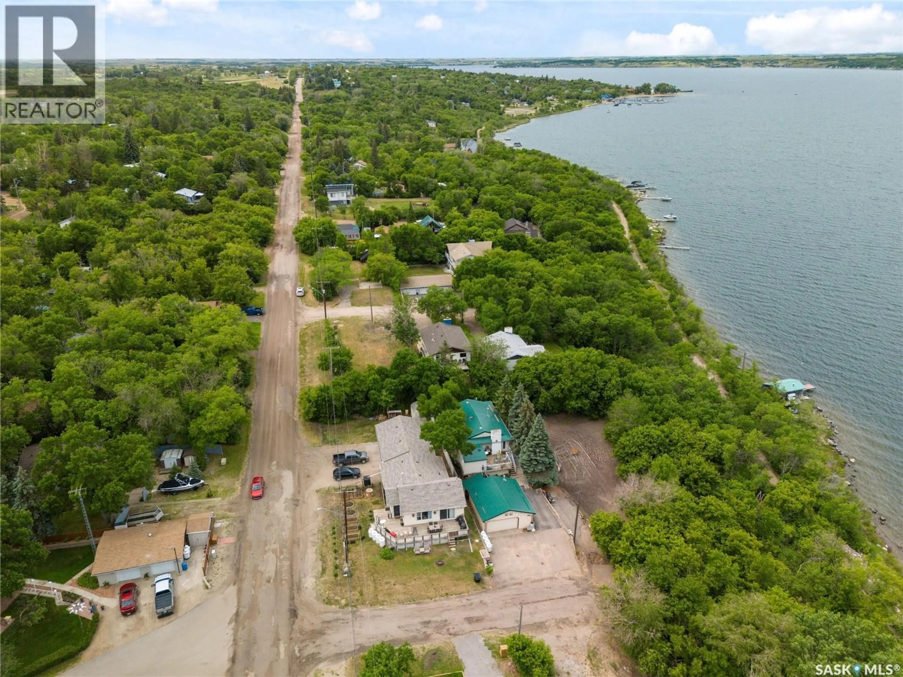 A pic from outside/outdoor area/front of a property/back of a property/a pic from drone, water/lake/river/ocean view for 461 13TH STREET, Regina Beach Saskatchewan S0G4C0