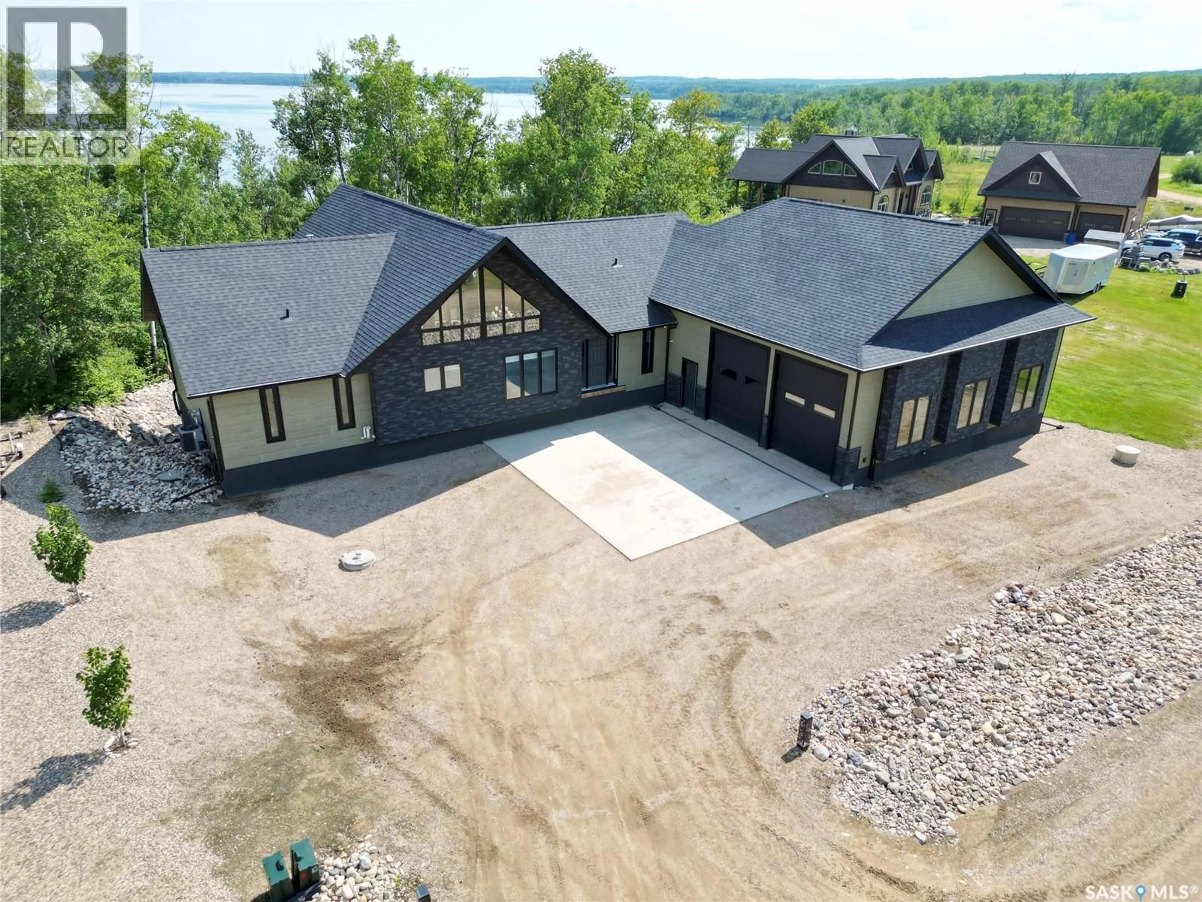 A pic from outside/outdoor area/front of a property/back of a property/a pic from drone, water/lake/river/ocean view for 2 DERBY LANE, Big Shell Saskatchewan S0J2G0
