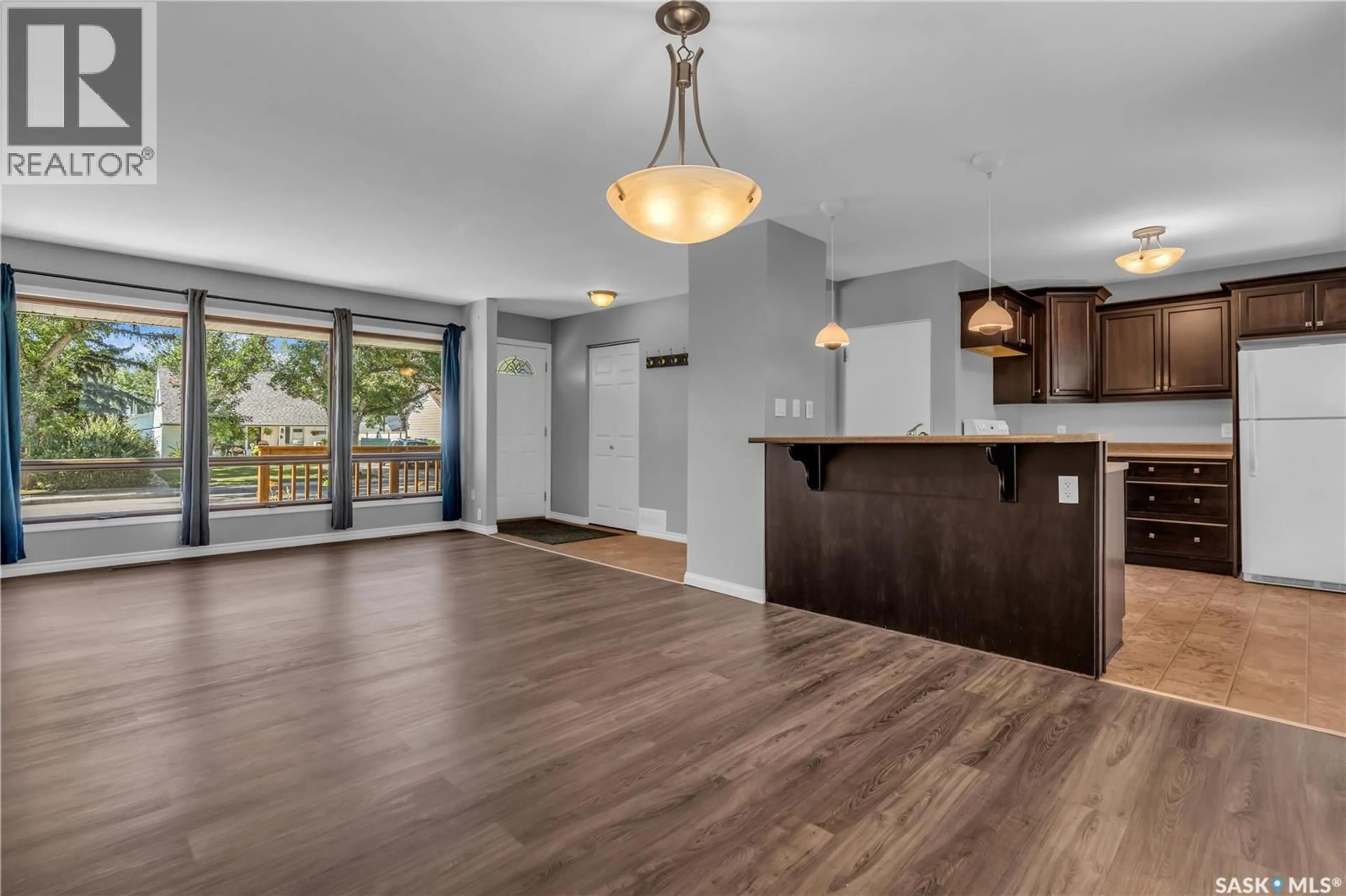 Open concept kitchen, wood/laminate floor for 3519 GARNER AVENUE, Regina Saskatchewan S4S1A3