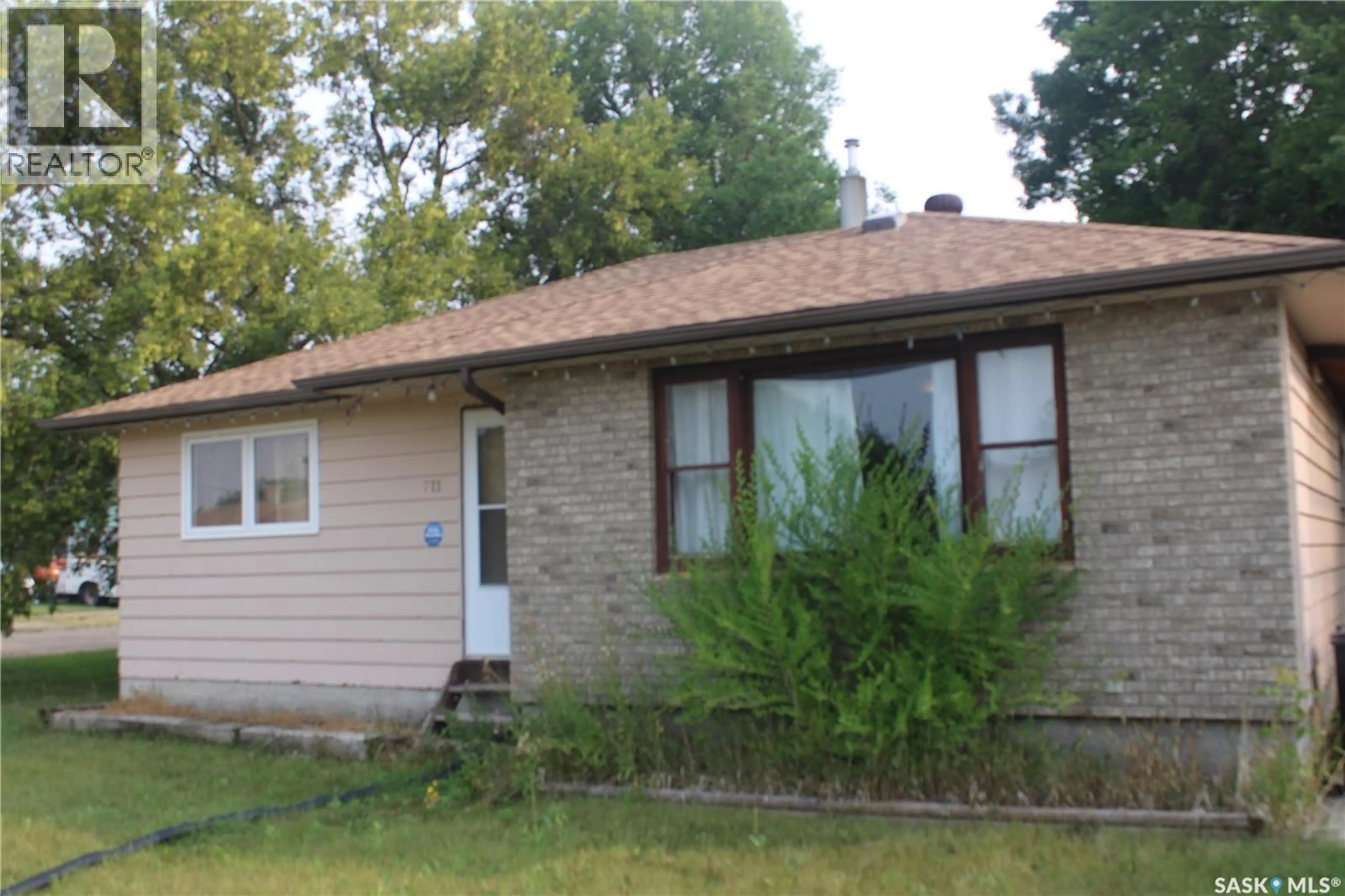 Home with vinyl exterior material, street for 711 YORKTON AVENUE, Theodore Saskatchewan S0A4C0