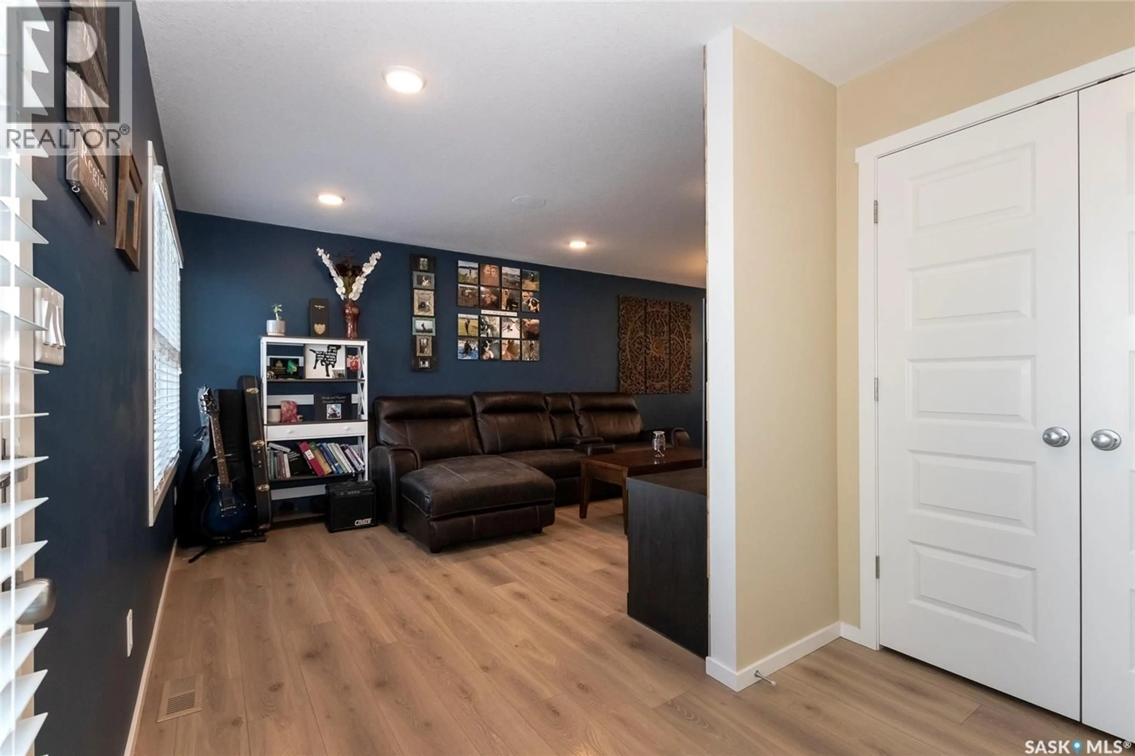 Living room with furniture, wood/laminate floor for 1705 RED SPRING STREET, Regina Saskatchewan S4Y0G4