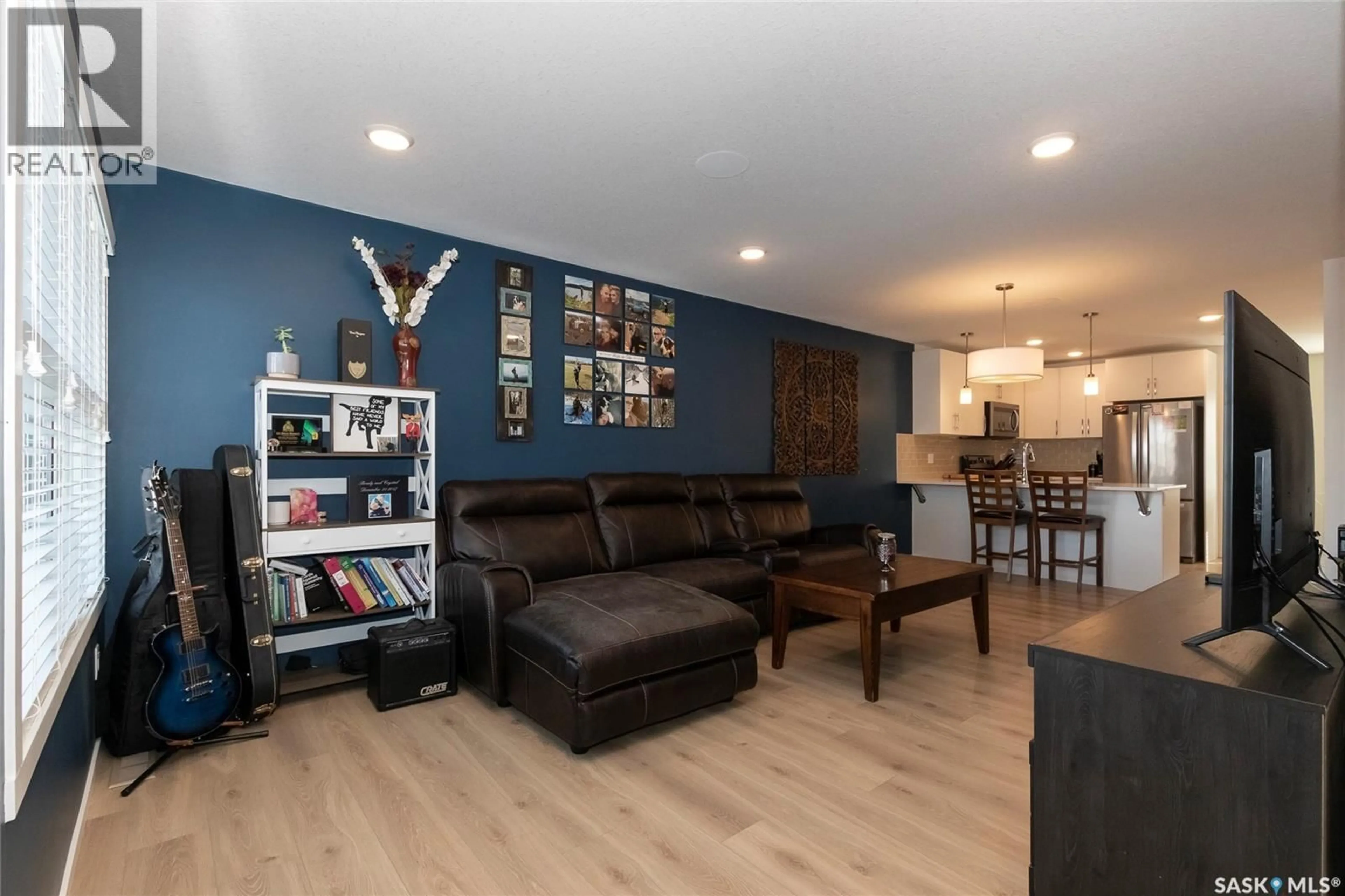 Living room with furniture, wood/laminate floor for 1705 RED SPRING STREET, Regina Saskatchewan S4Y0G4