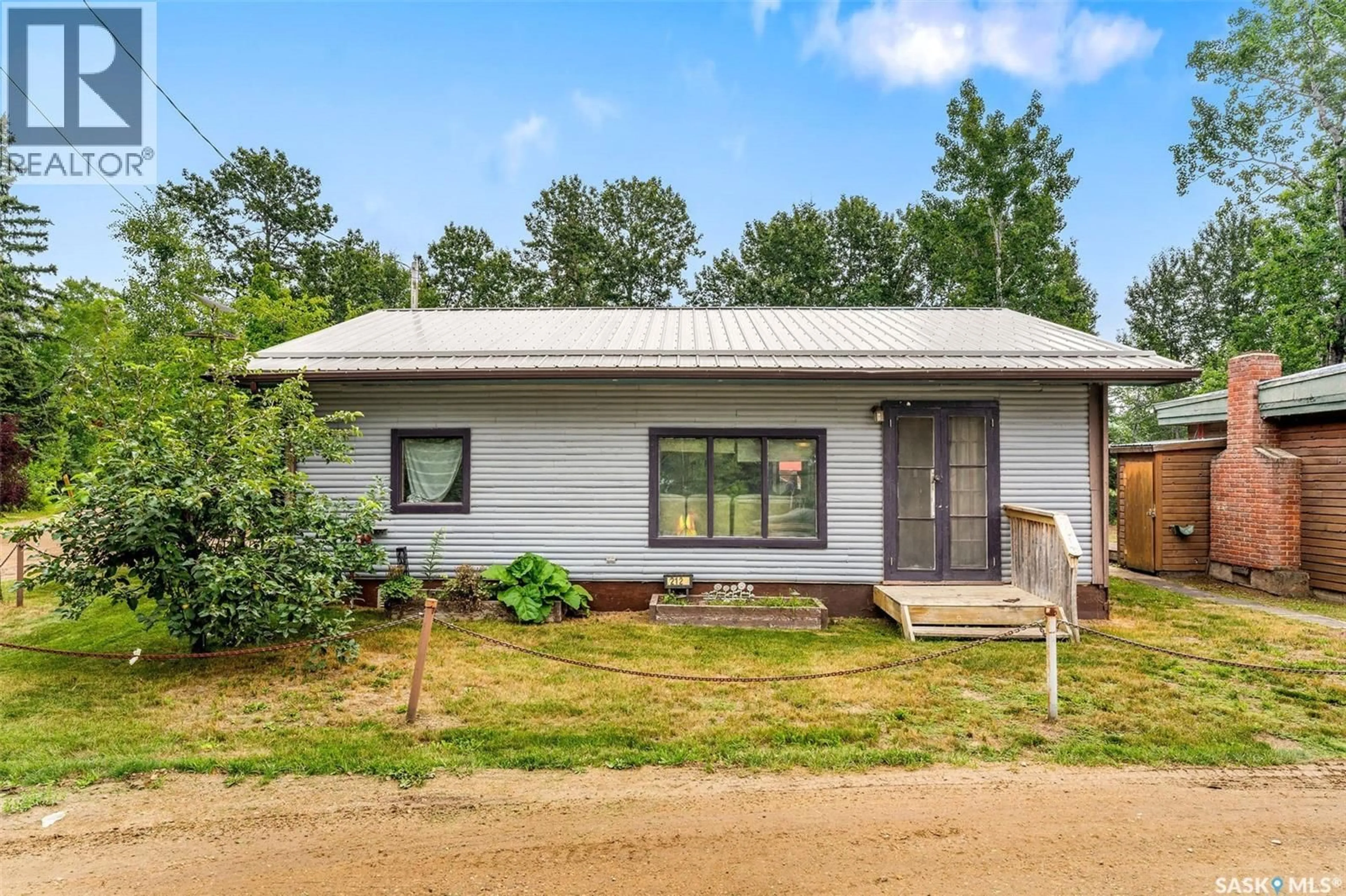 Home with vinyl exterior material, building for 212 SPRUCE DRIVE, Lakeland Rm No. 521 Saskatchewan S0J0N0