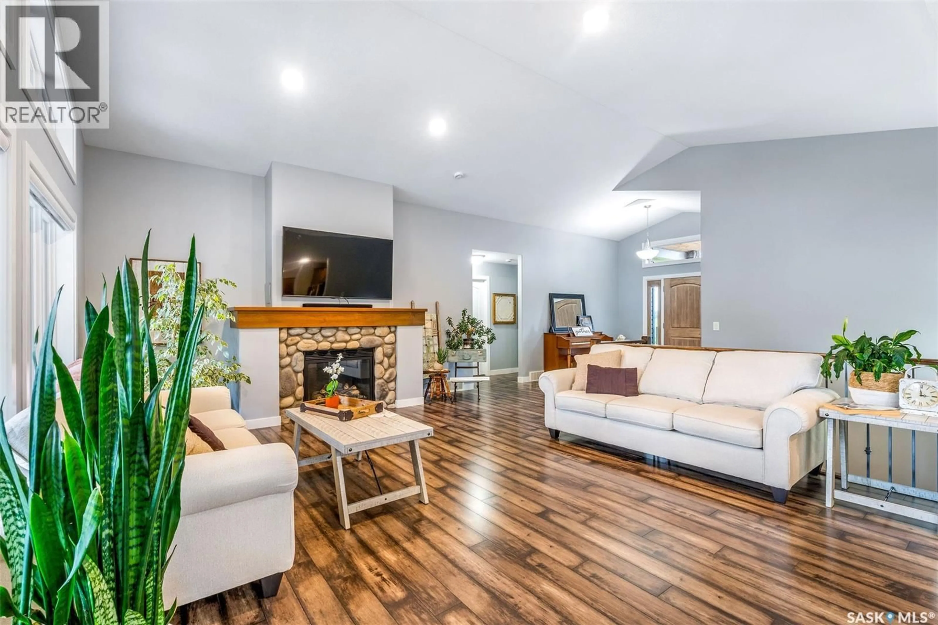 Living room with furniture, wood/laminate floor for 28 PAPE DRIVE, Humboldt Rm No. 370 Saskatchewan S0K2A0