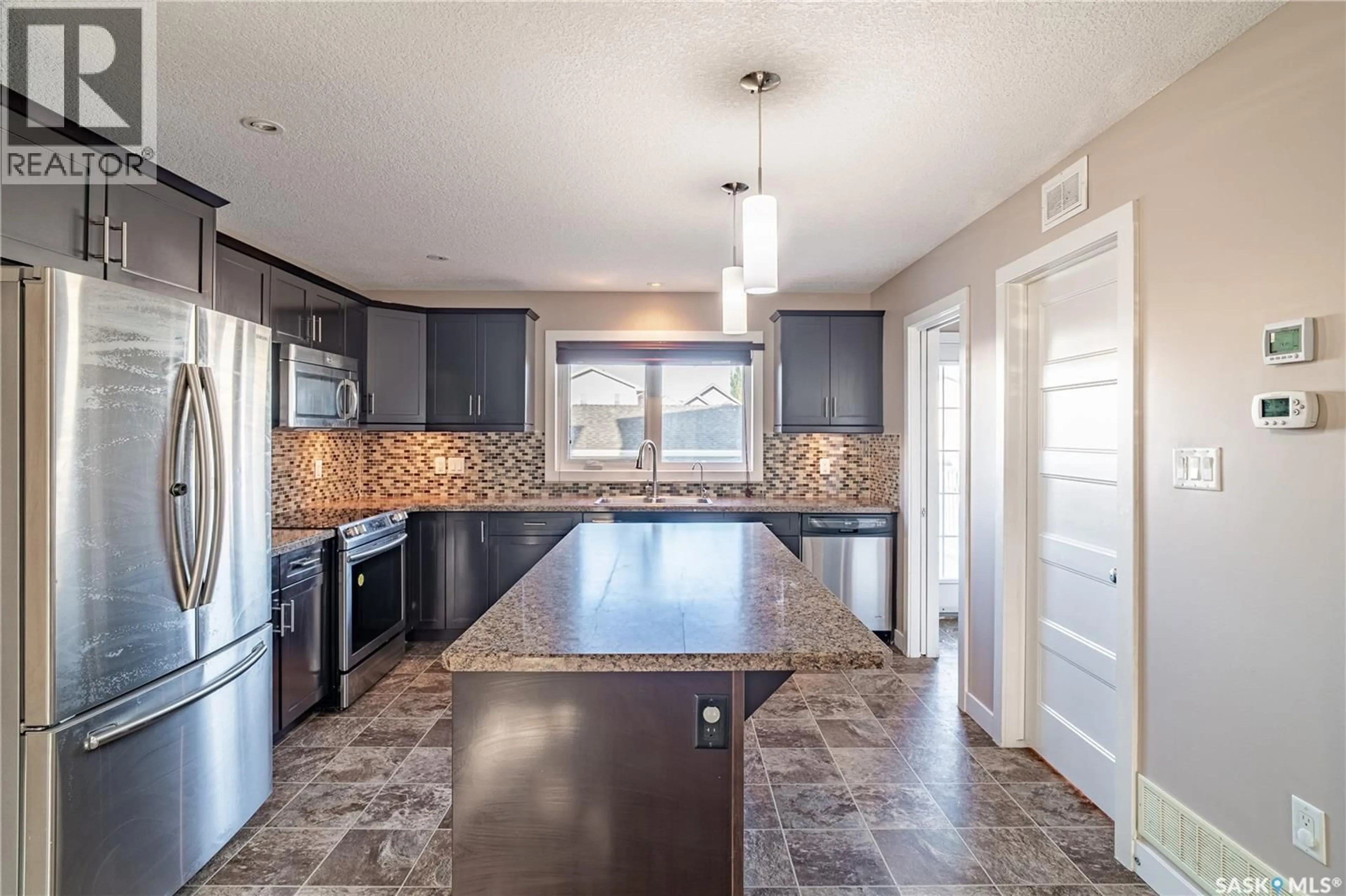 Open concept kitchen, ceramic/tile floor for 4469 JAMES HILL ROAD, Regina Saskatchewan S4W0K5