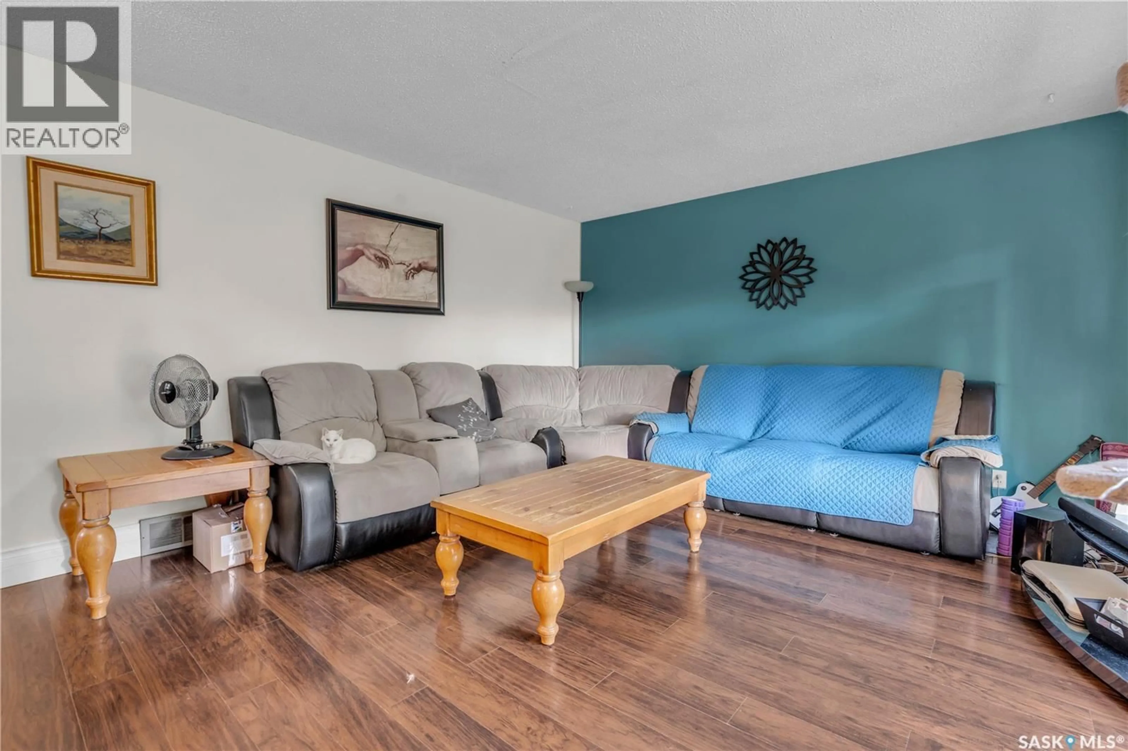 Living room with furniture, wood/laminate floor for 830 BATTEL STREET, Regina Saskatchewan S4X2H8