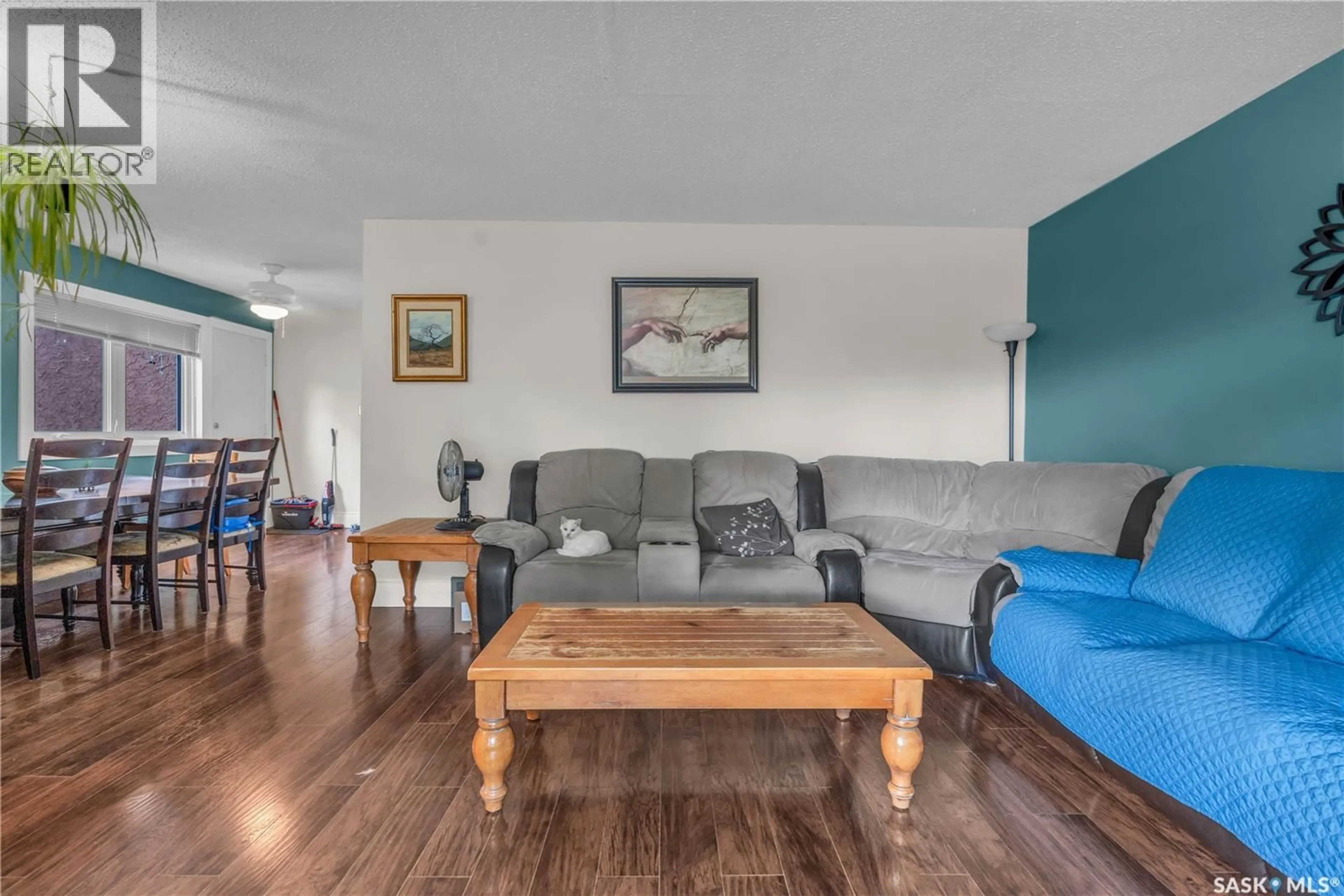 Living room with furniture, wood/laminate floor for 830 BATTEL STREET, Regina Saskatchewan S4X2H8