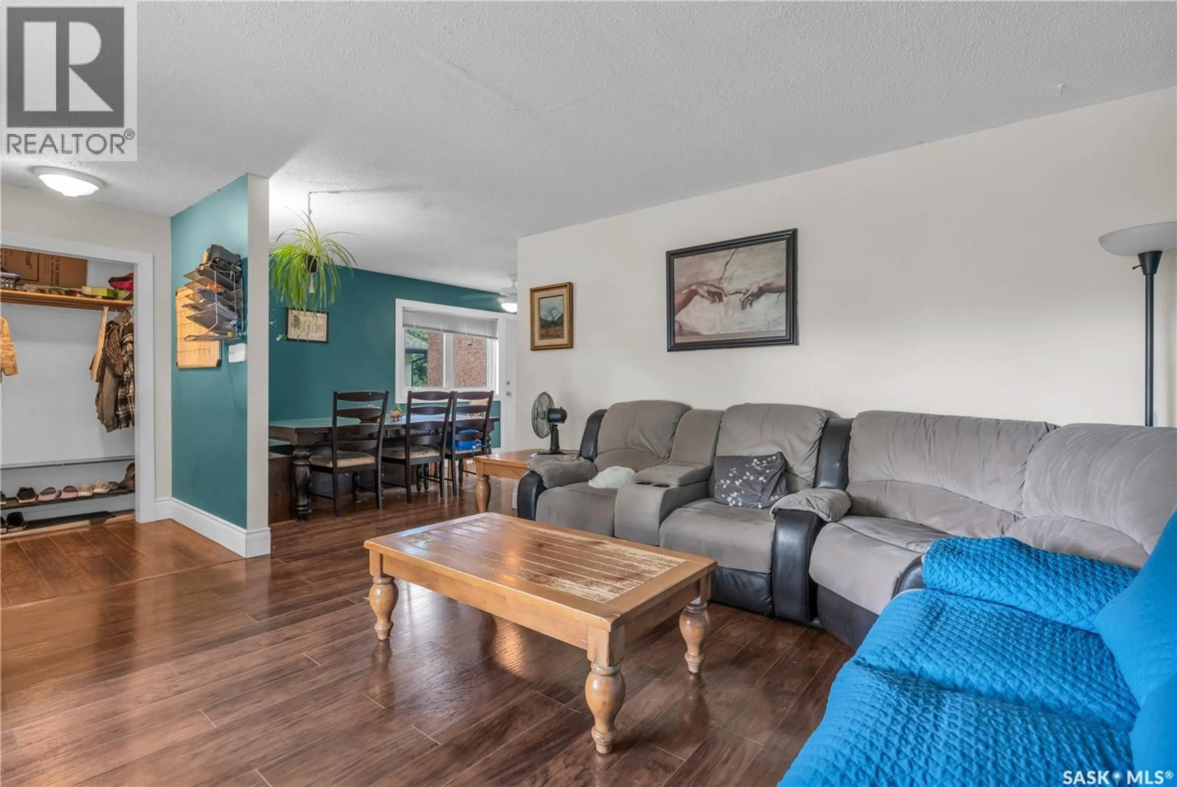 Living room with furniture, wood/laminate floor for 830 BATTEL STREET, Regina Saskatchewan S4X2H8