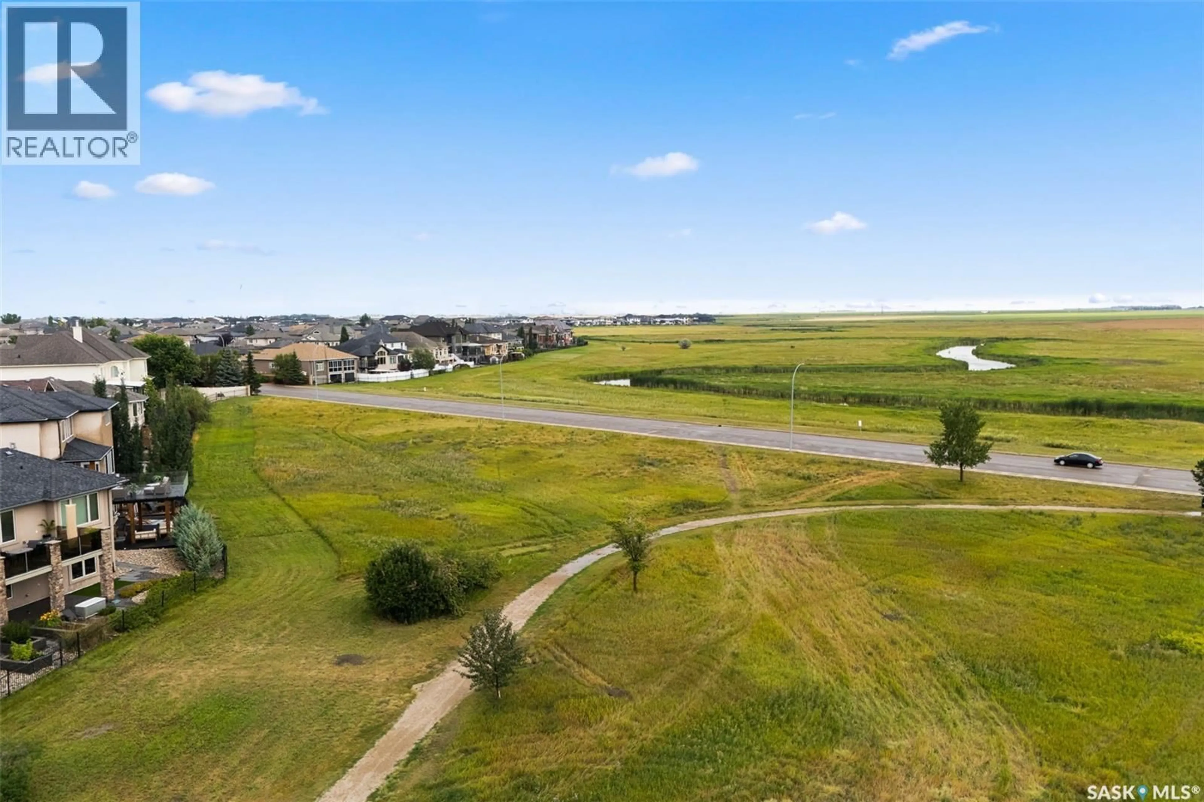 A pic from outside/outdoor area/front of a property/back of a property/a pic from drone, water/lake/river/ocean view for 6110 WASCANA COURT, Regina Saskatchewan S4V3E7