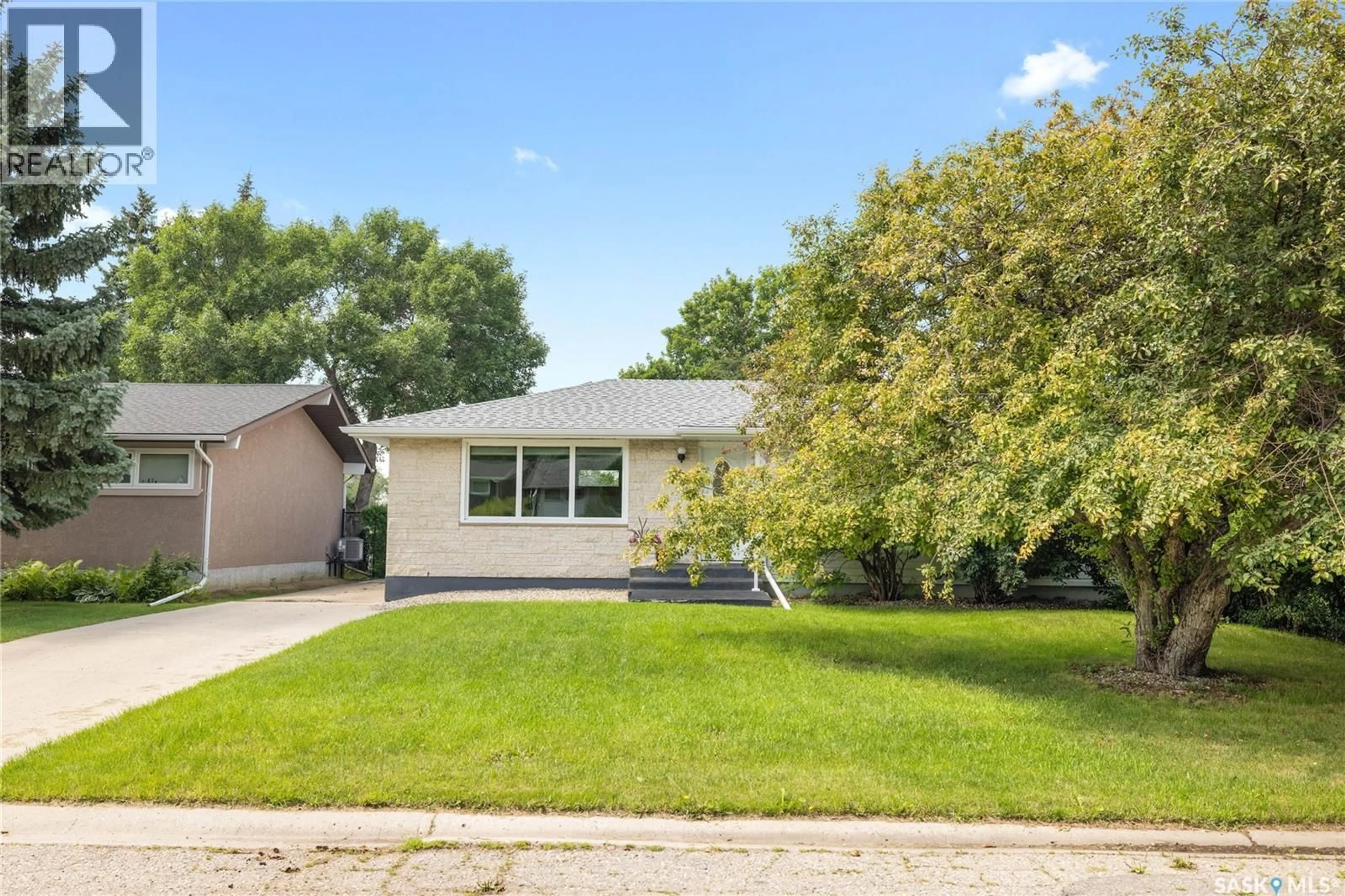 Home with vinyl exterior material, street for 3 ROSEWOOD PLACE, Regina Saskatchewan S4S5N5