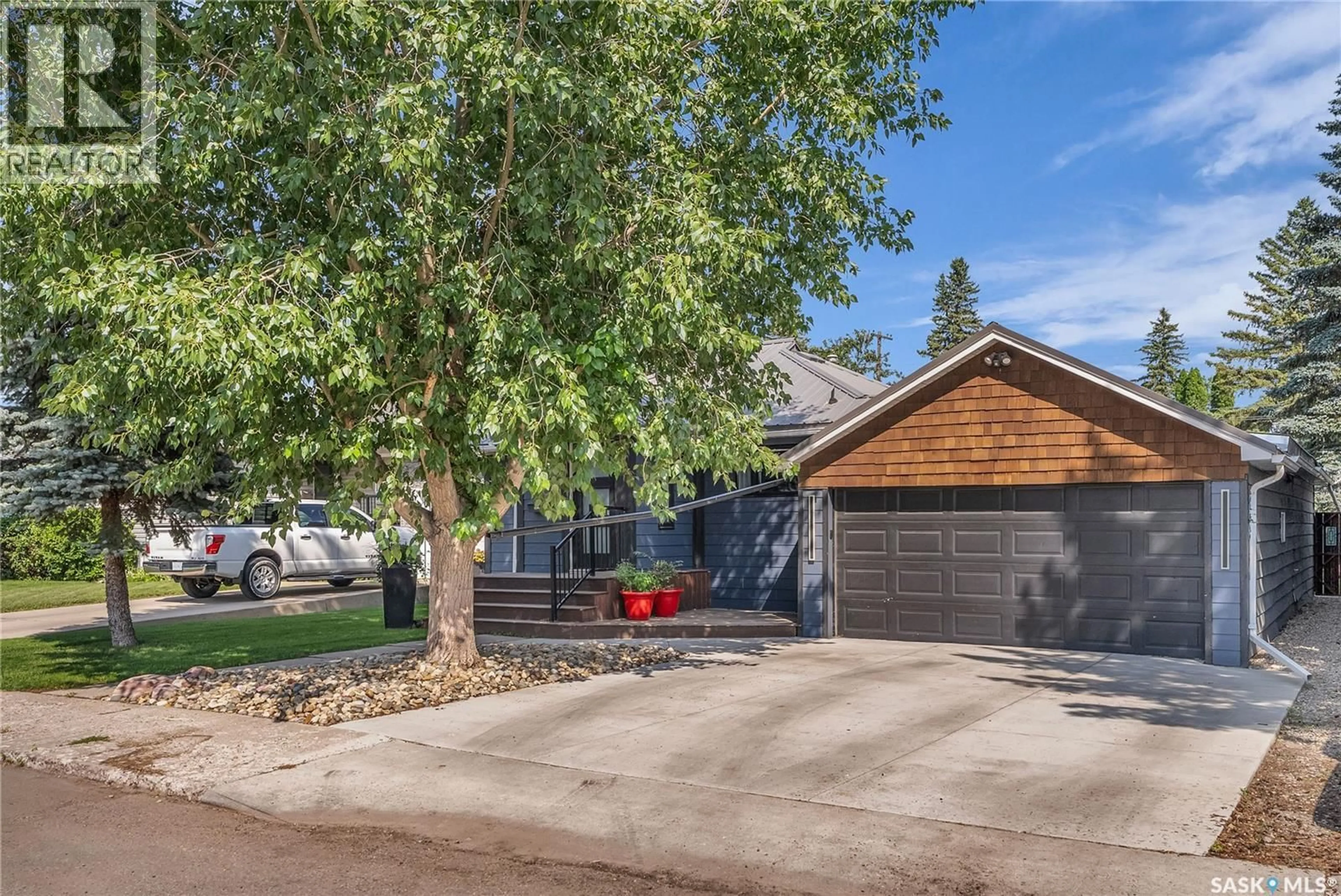 Home with vinyl exterior material, street for 2115 YORK AVENUE, Saskatoon Saskatchewan S7J1H7
