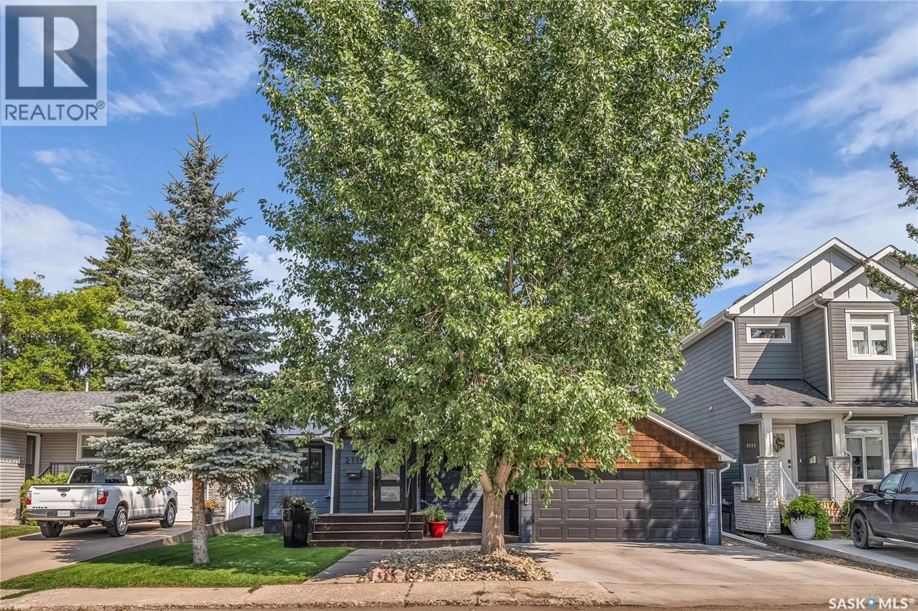 Home with vinyl exterior material, street for 2115 YORK AVENUE, Saskatoon Saskatchewan S7J1H7