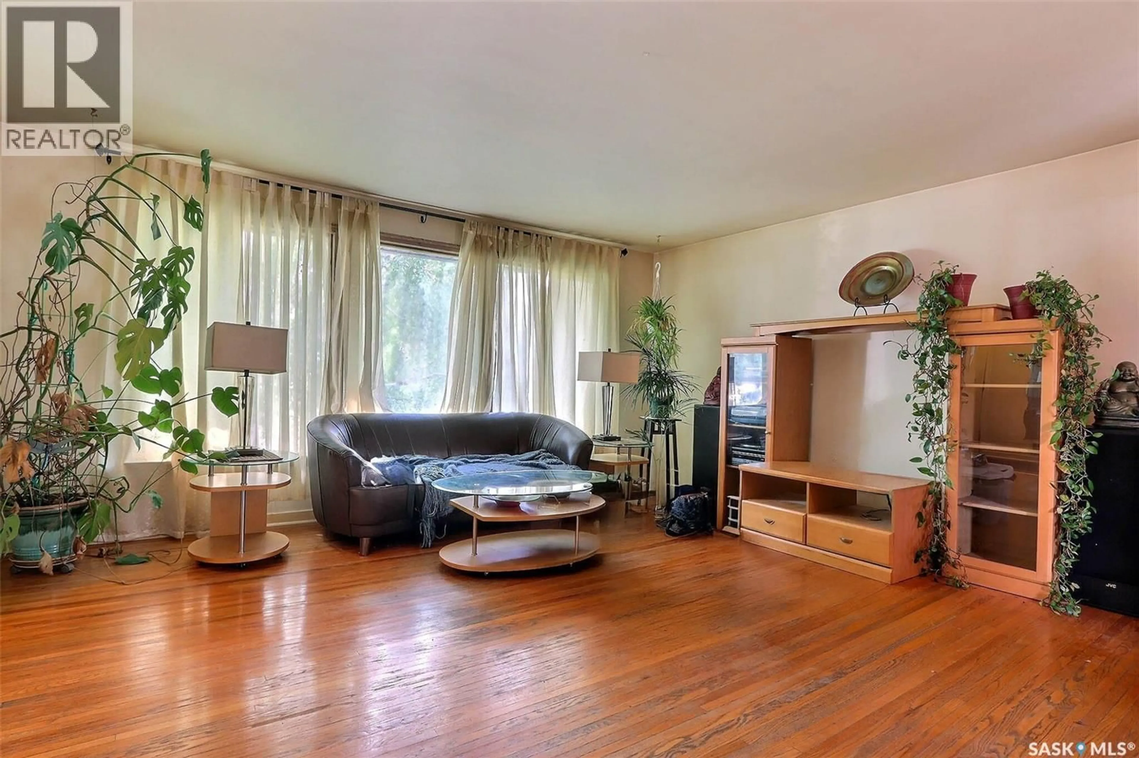 Living room with furniture, wood/laminate floor for 348 22ND STREET, Prince Albert Saskatchewan S6V4K4