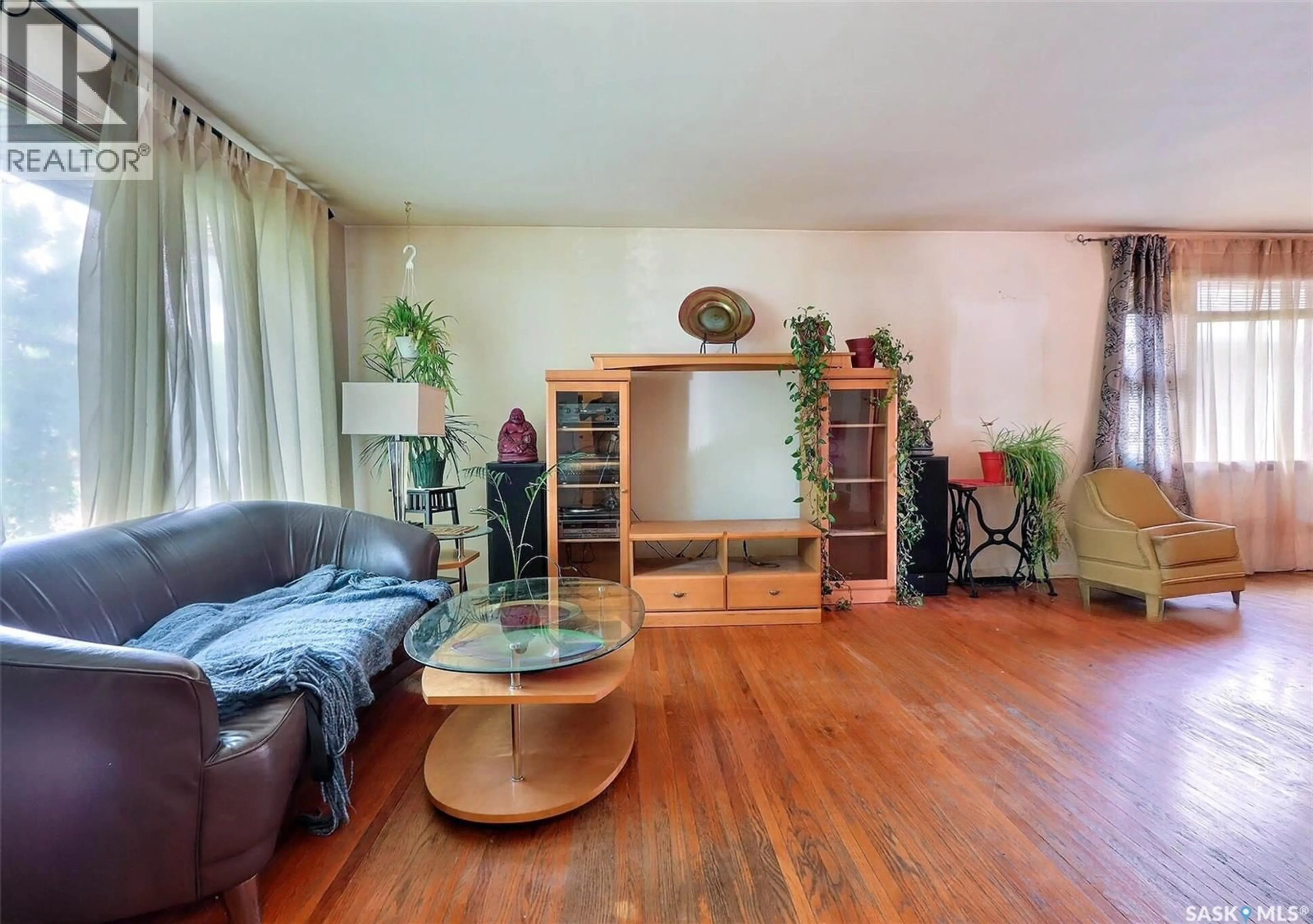 Living room with furniture, wood/laminate floor for 348 22ND STREET, Prince Albert Saskatchewan S6V4K4