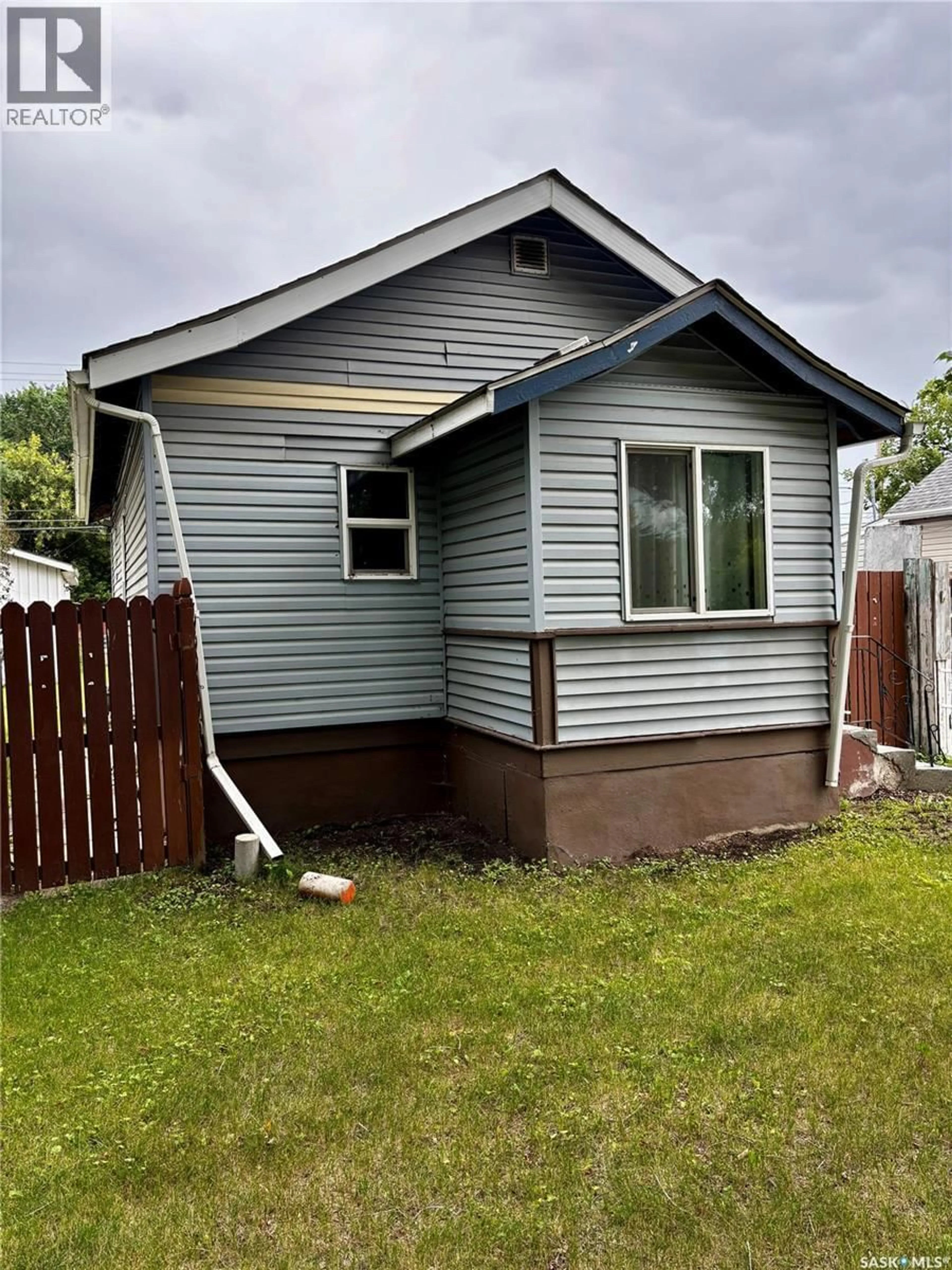 Home with vinyl exterior material, street for 1306 B AVENUE, Saskatoon Saskatchewan S7L1G5