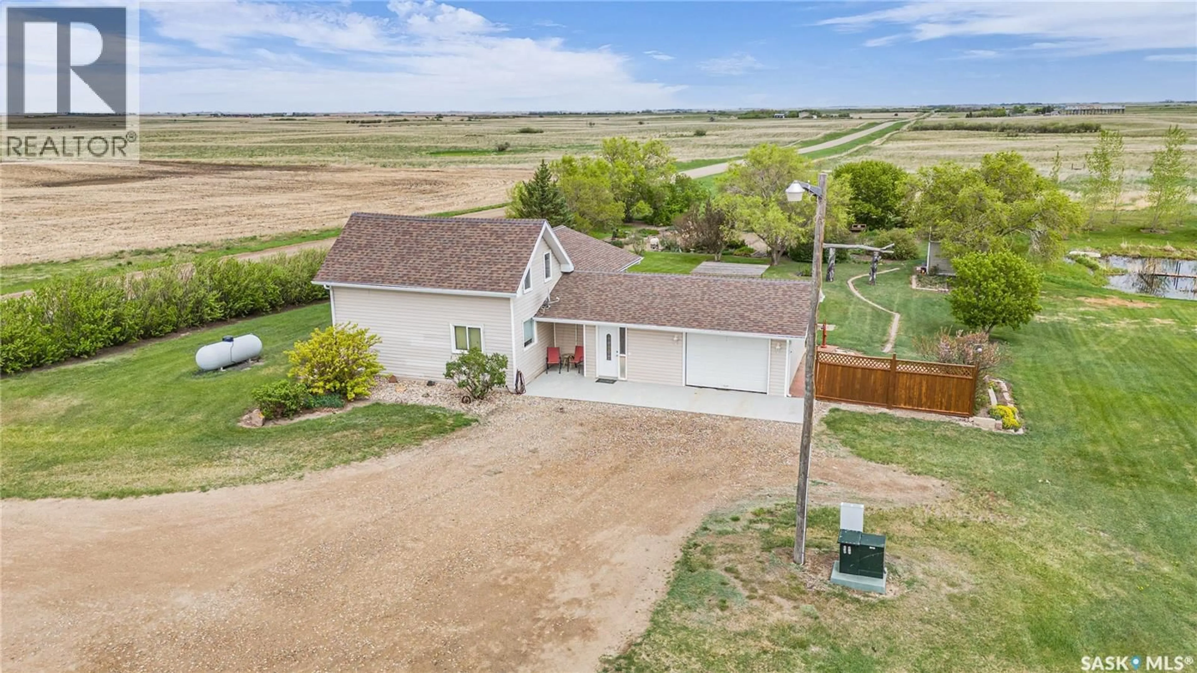 A pic from outside/outdoor area/front of a property/back of a property/a pic from drone, water/lake/river/ocean view for MOUNTENAY ACREAGE, Dufferin Rm No. 190 Saskatchewan S0G0H0