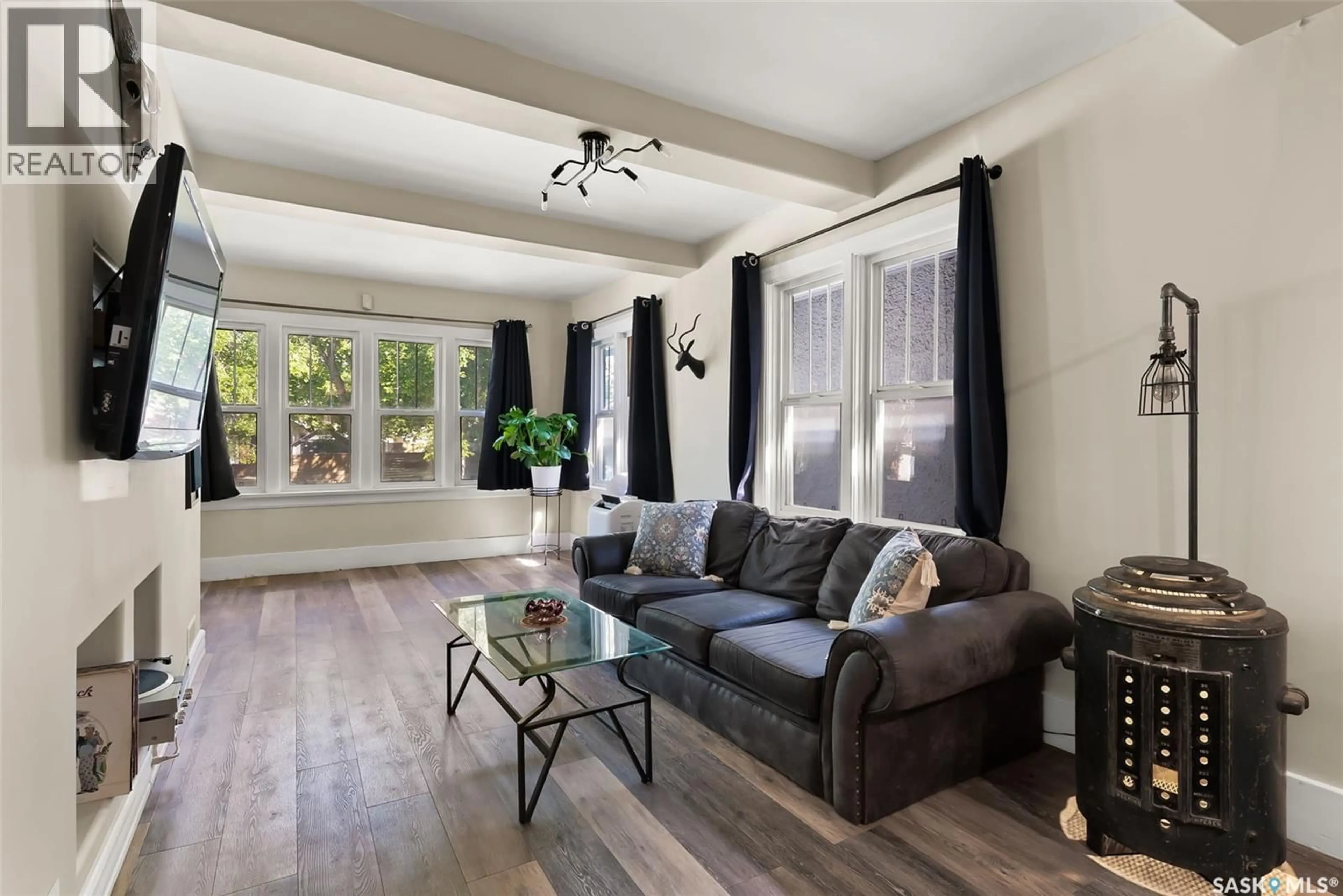 Living room with furniture, wood/laminate floor for 2336 ATKINSON STREET, Regina Saskatchewan S4N3X3