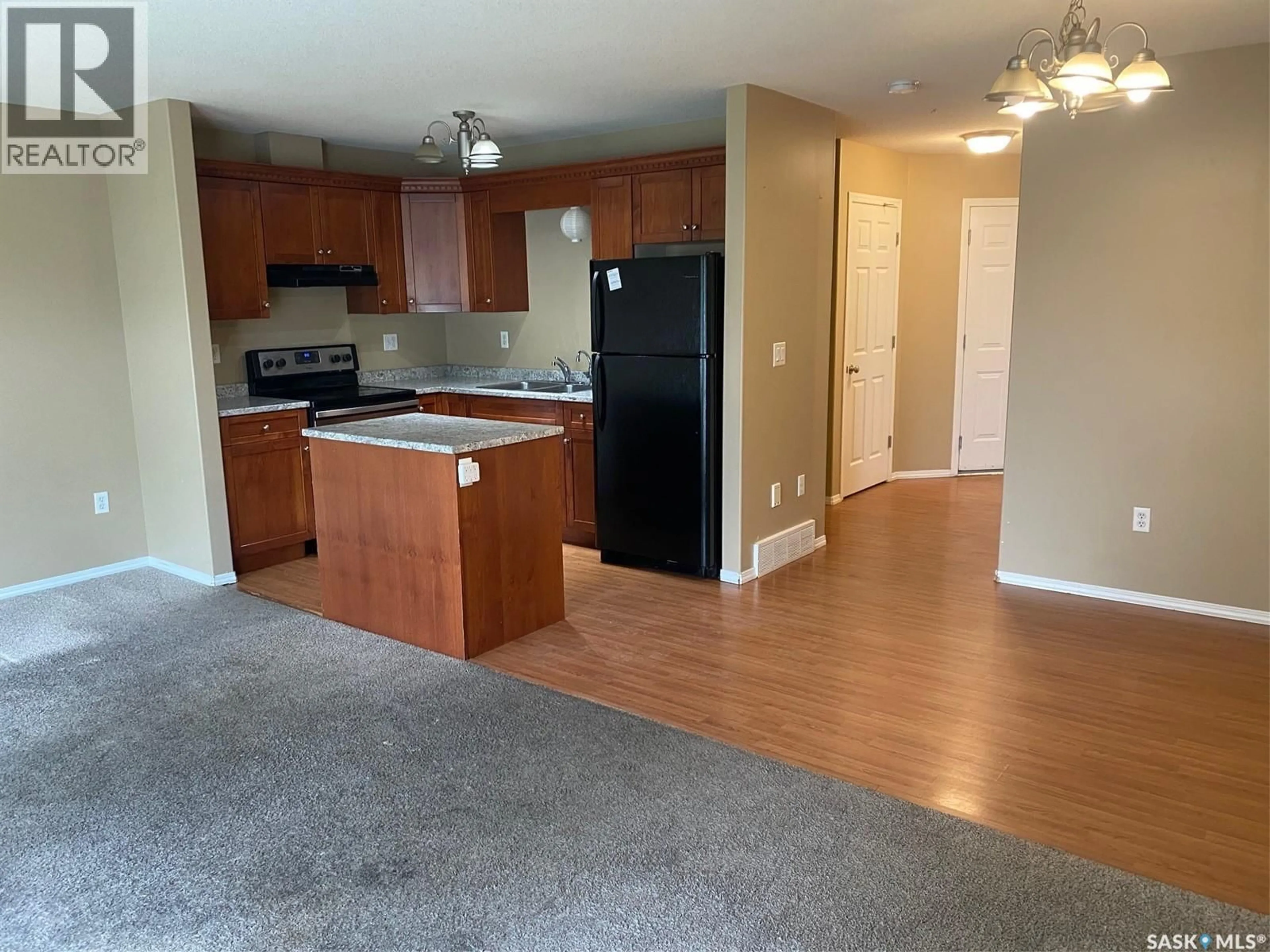 Open concept kitchen, wood/laminate floor for 4620 MARIGOLD DRIVE, Regina Saskatchewan S4X4S5