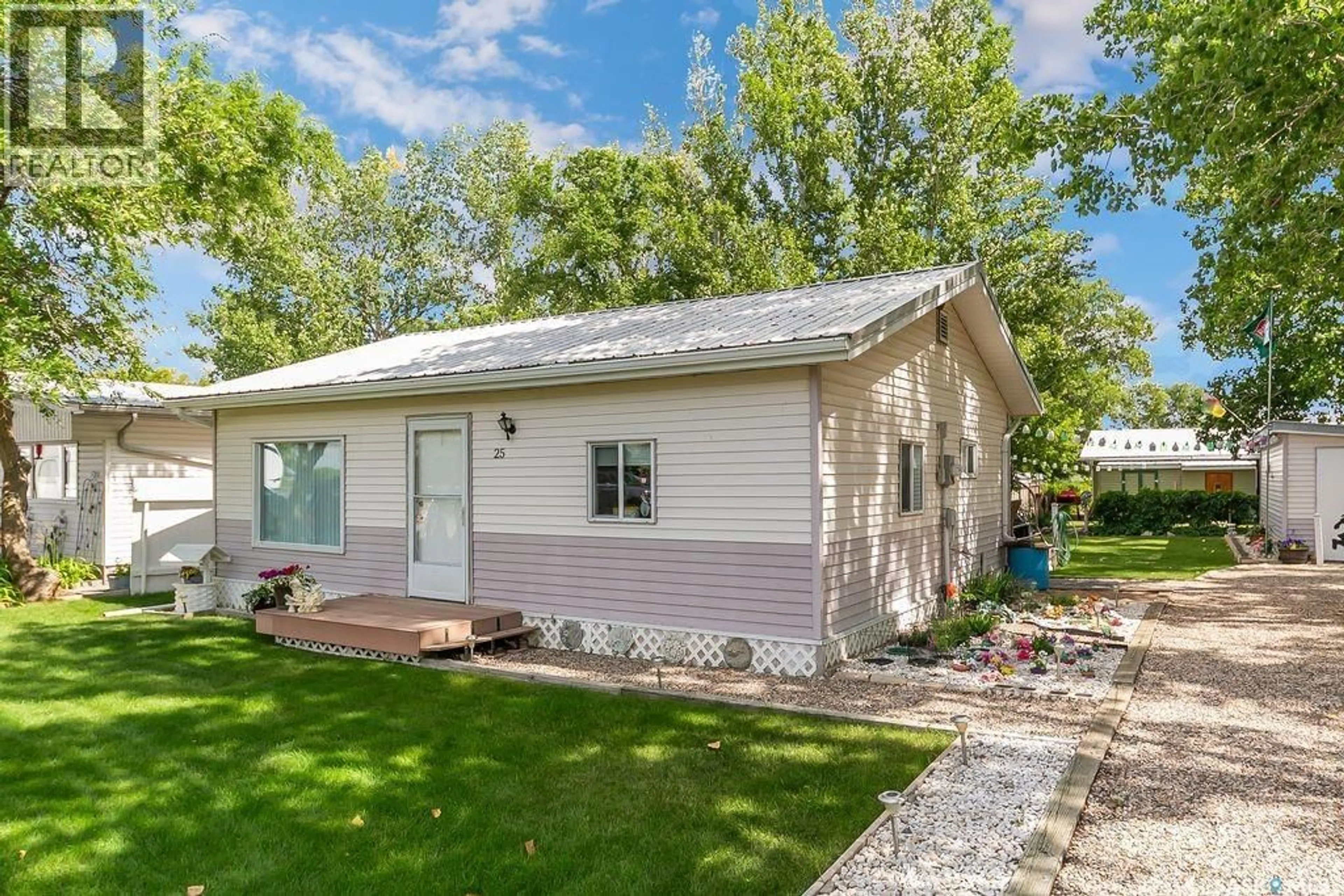 Home with vinyl exterior material, street for 25 MAPLE STREET, Grandview Beach Saskatchewan S0G1C0