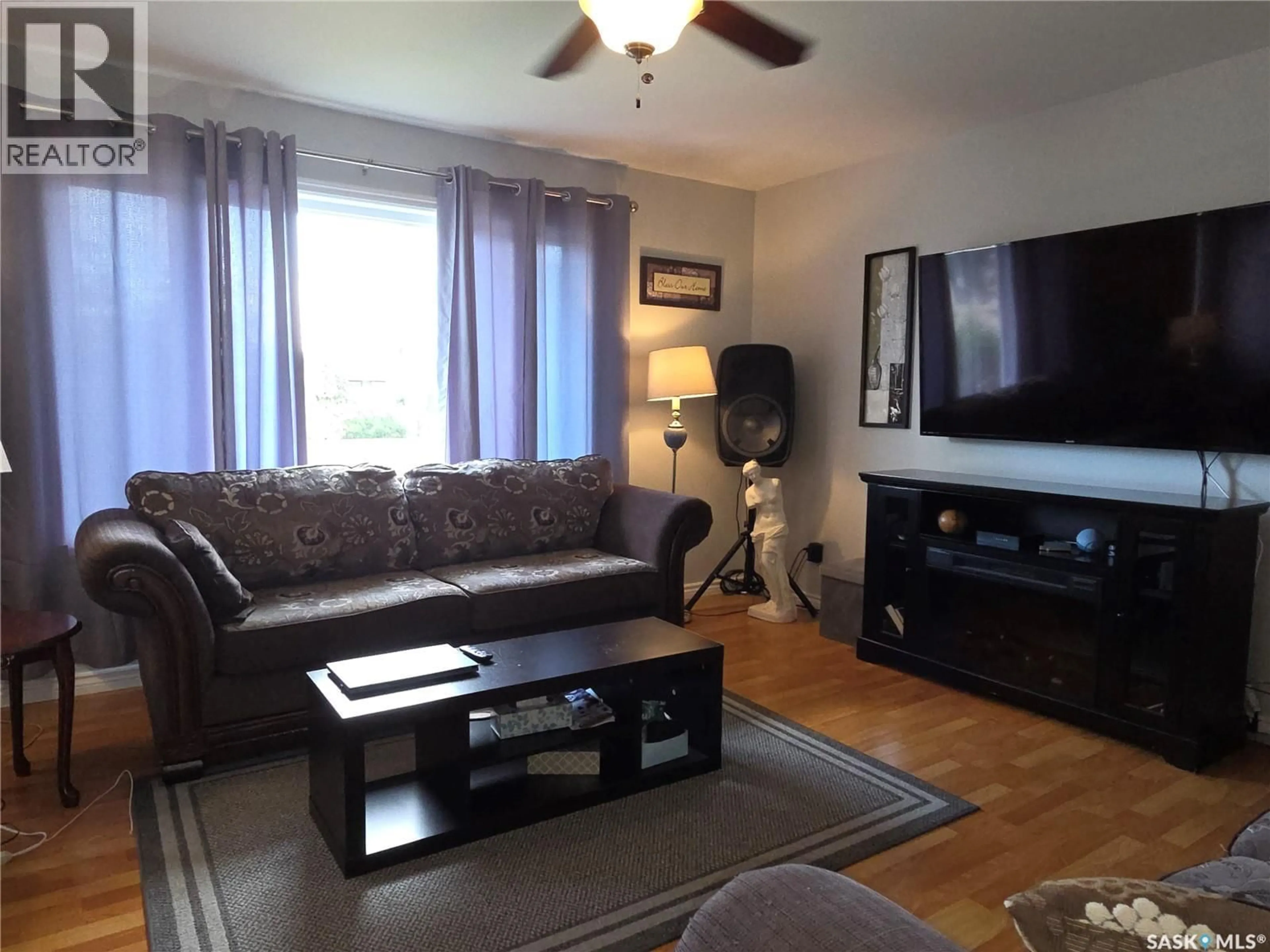 Living room with furniture, wood/laminate floor for 337 MAIN STREET, Allan Saskatchewan S0K0C0