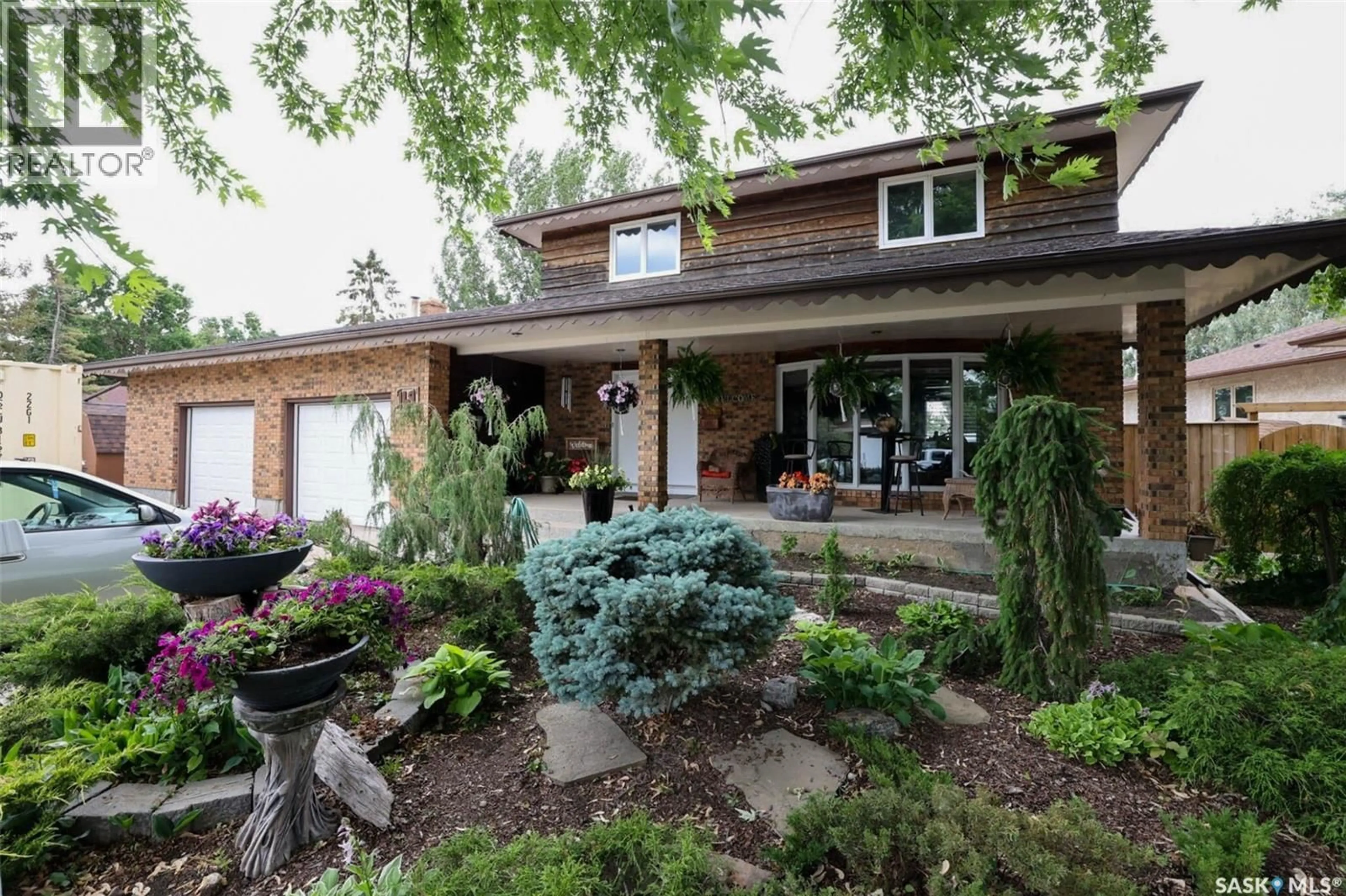 Home with brick exterior material, street for 169 DALGLIESH DRIVE, Regina Saskatchewan S4R7Y9