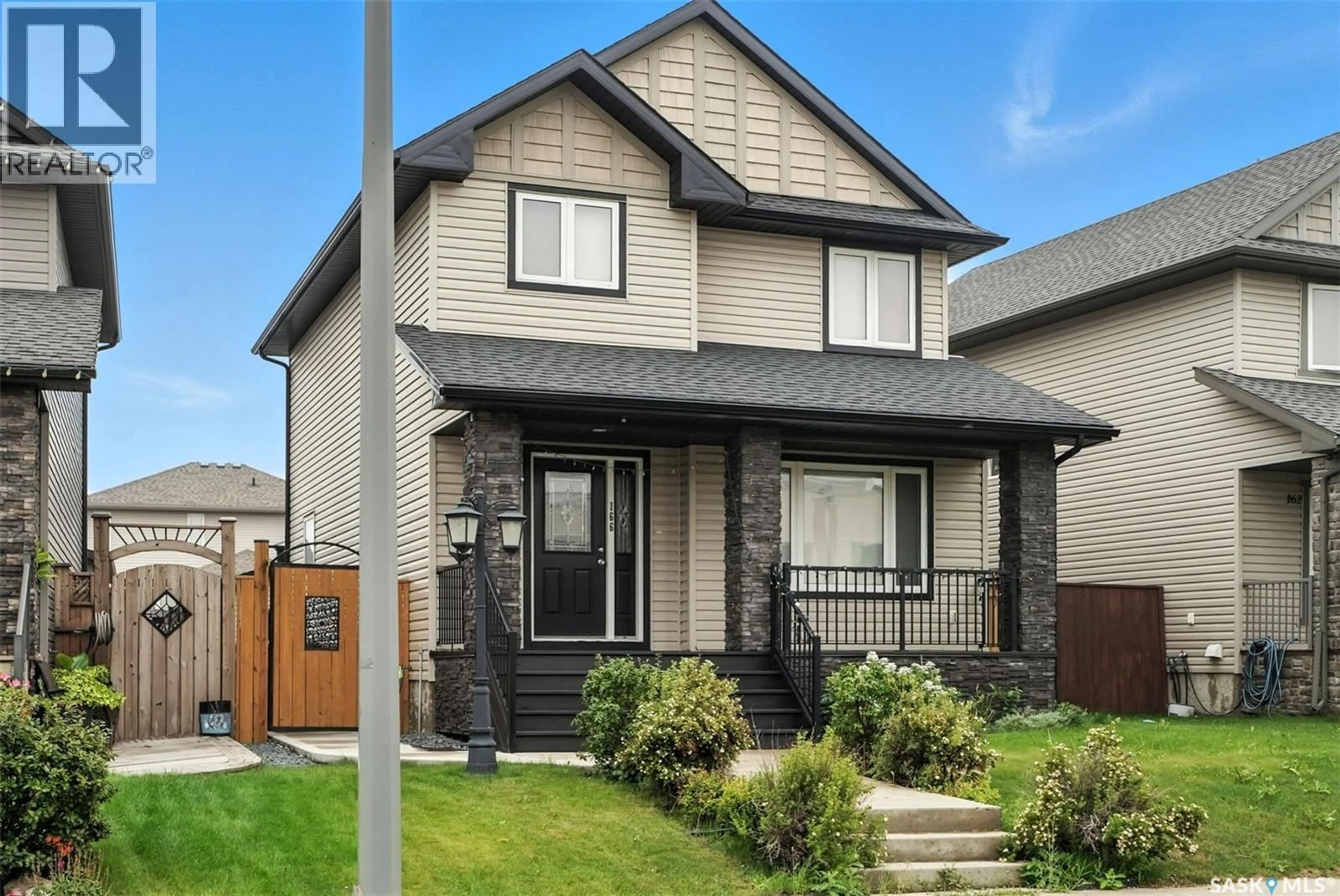 Home with vinyl exterior material, street for 166 CORNISH ROAD, Saskatoon Saskatchewan S7T0K4
