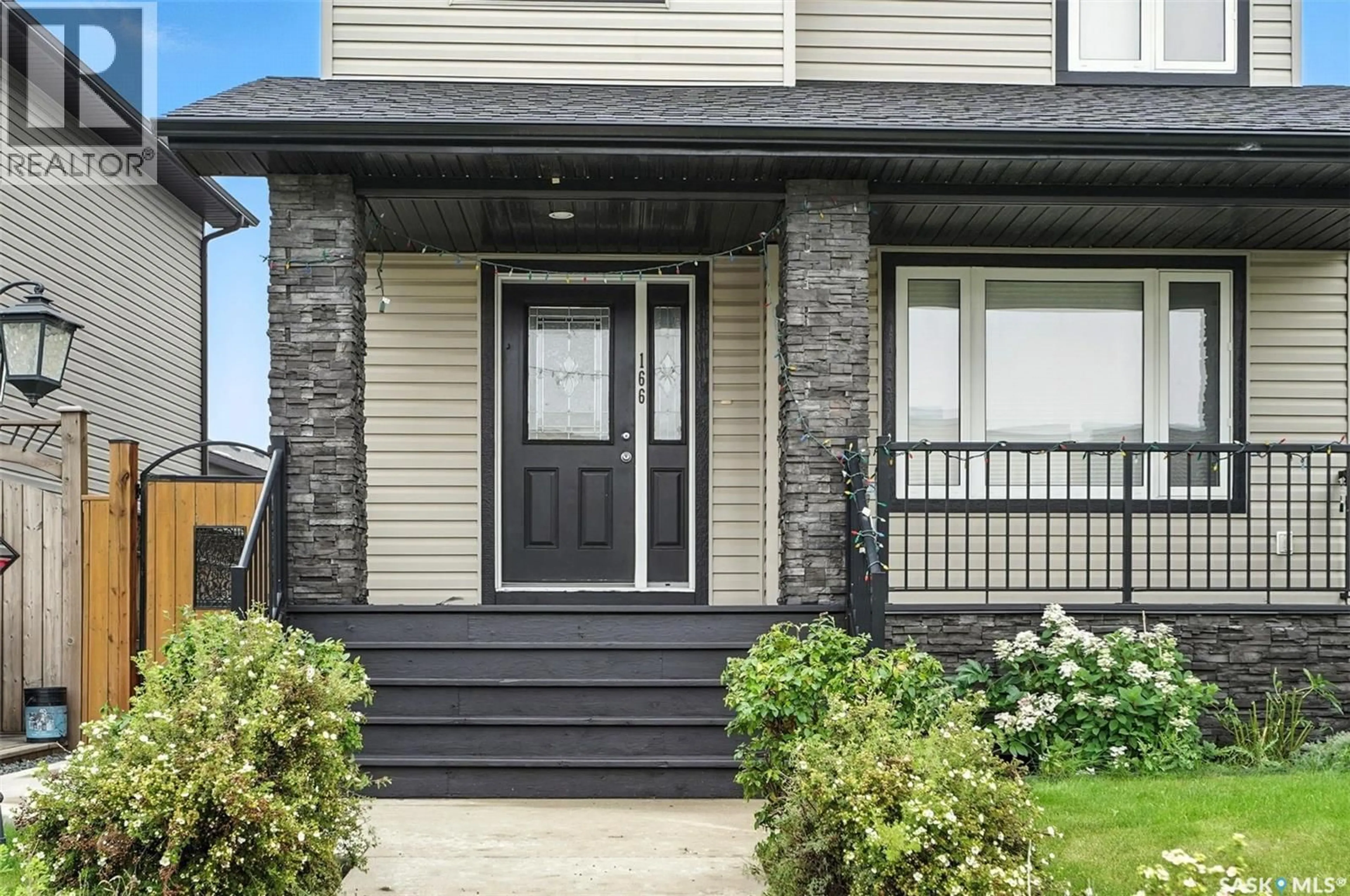 Home with vinyl exterior material, street for 166 CORNISH ROAD, Saskatoon Saskatchewan S7T0K4