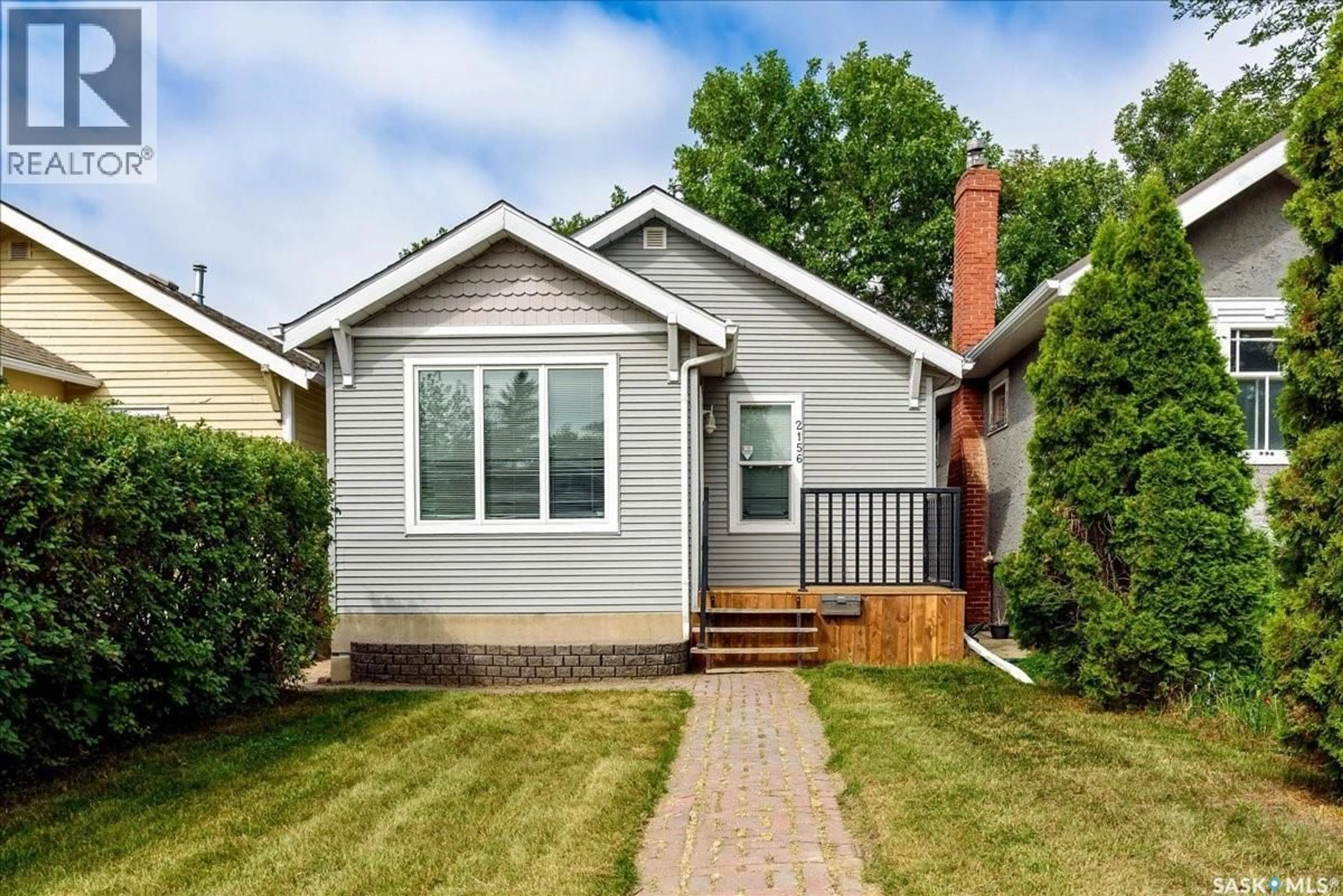 Home with vinyl exterior material, street for 2156 QUEEN STREET, Regina Saskatchewan S4T4C3