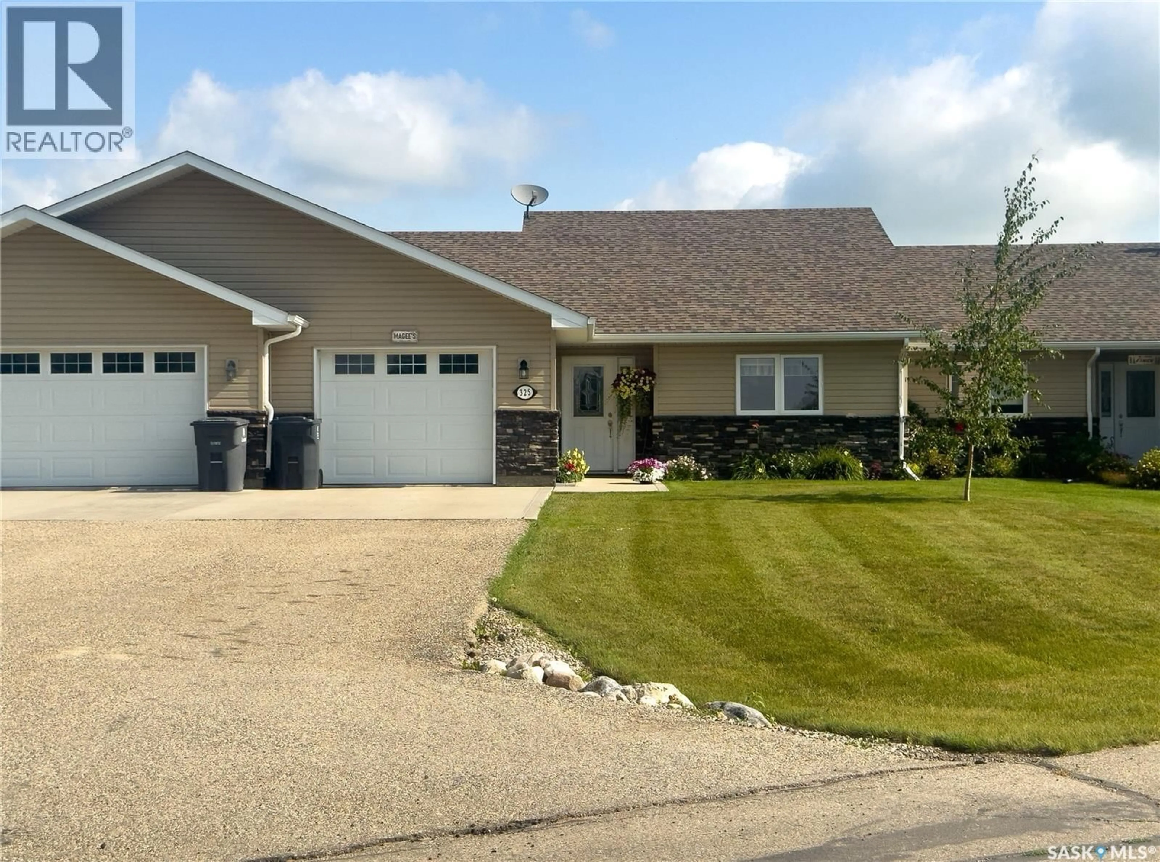 Home with vinyl exterior material, street for 325 2ND STREET, Waldheim Saskatchewan S0K4R0