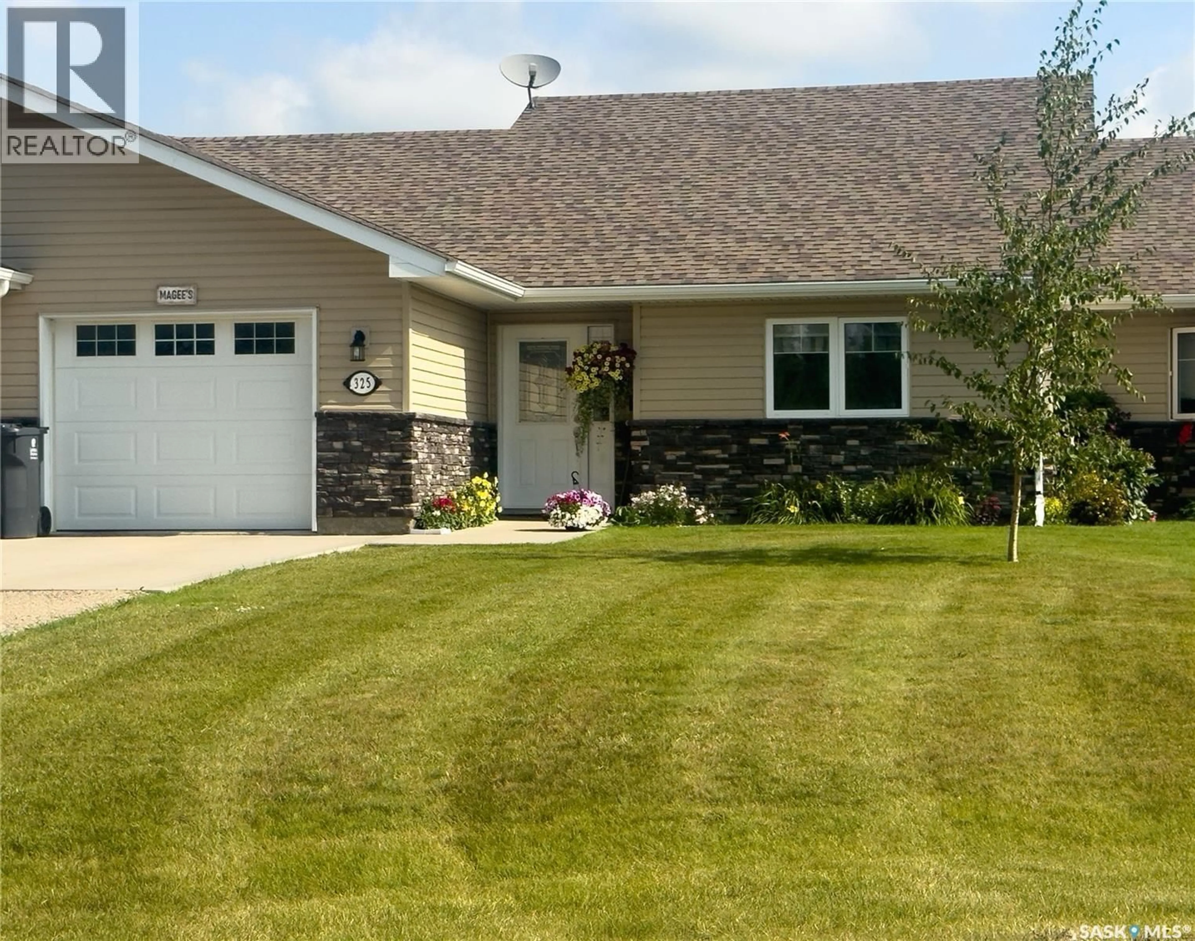 Home with vinyl exterior material, street for 325 2ND STREET, Waldheim Saskatchewan S0K4R0