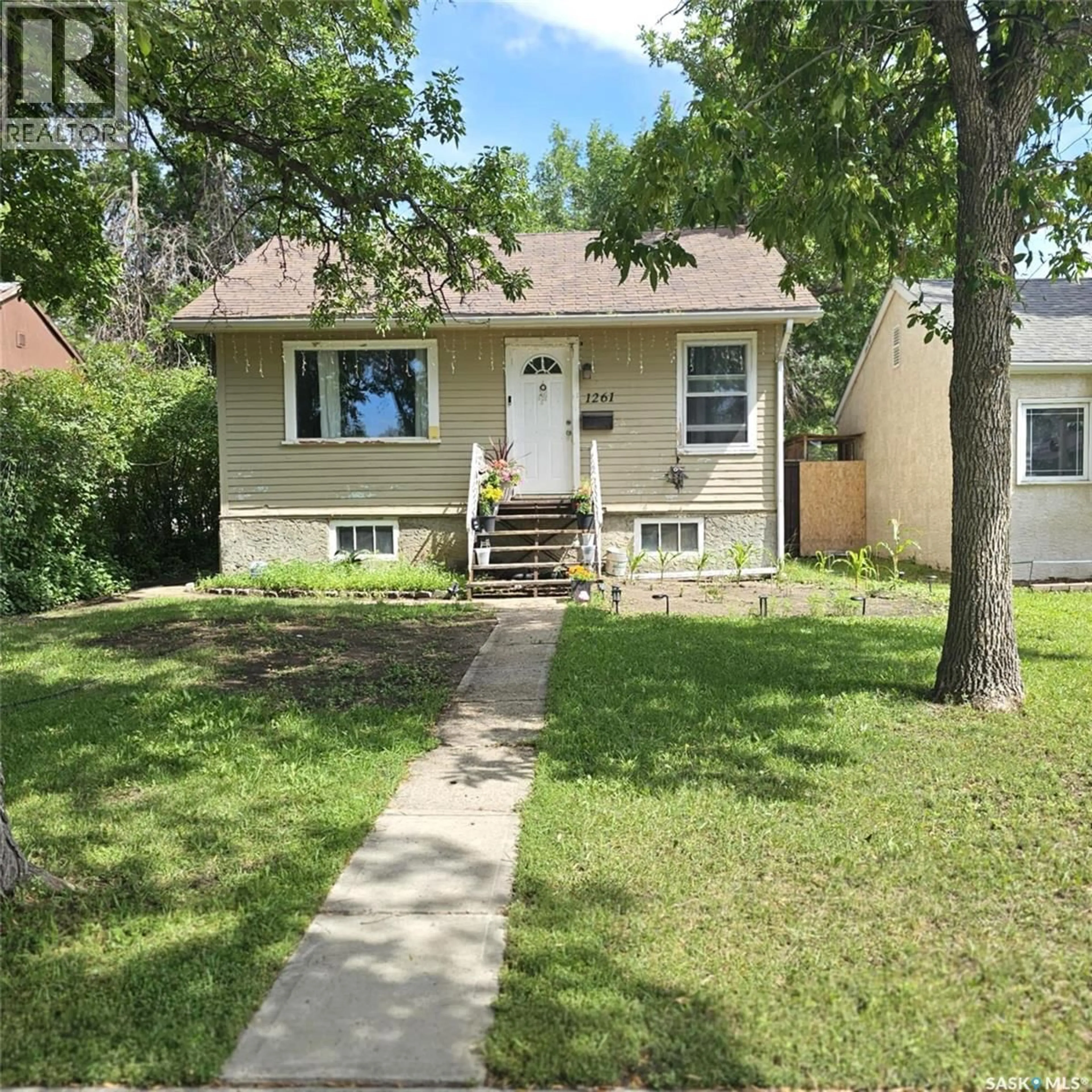 Home with vinyl exterior material, street for 1261 ATKINSON STREET, Regina Saskatchewan S4N3V7
