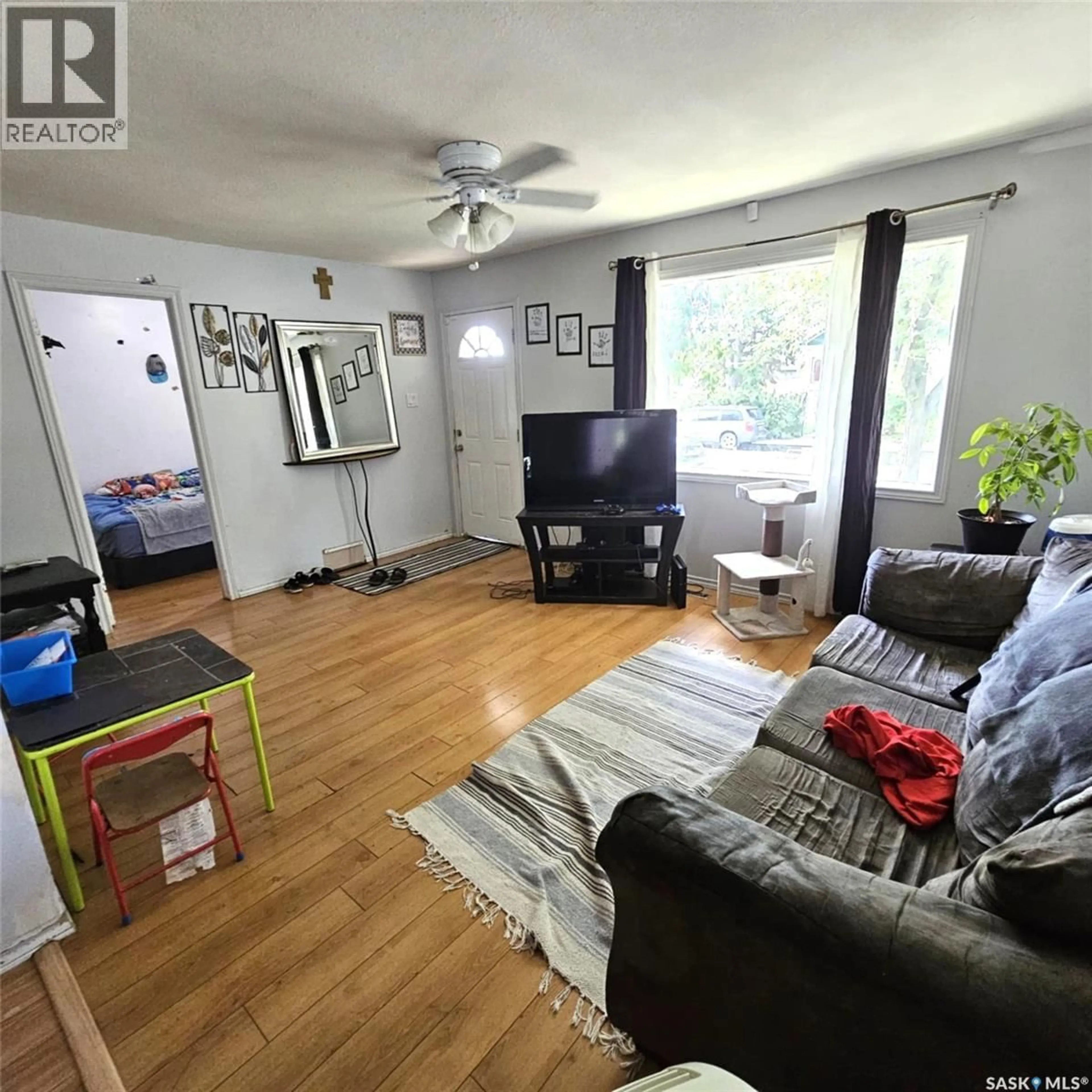 Living room with furniture, wood/laminate floor for 1261 ATKINSON STREET, Regina Saskatchewan S4N3V7