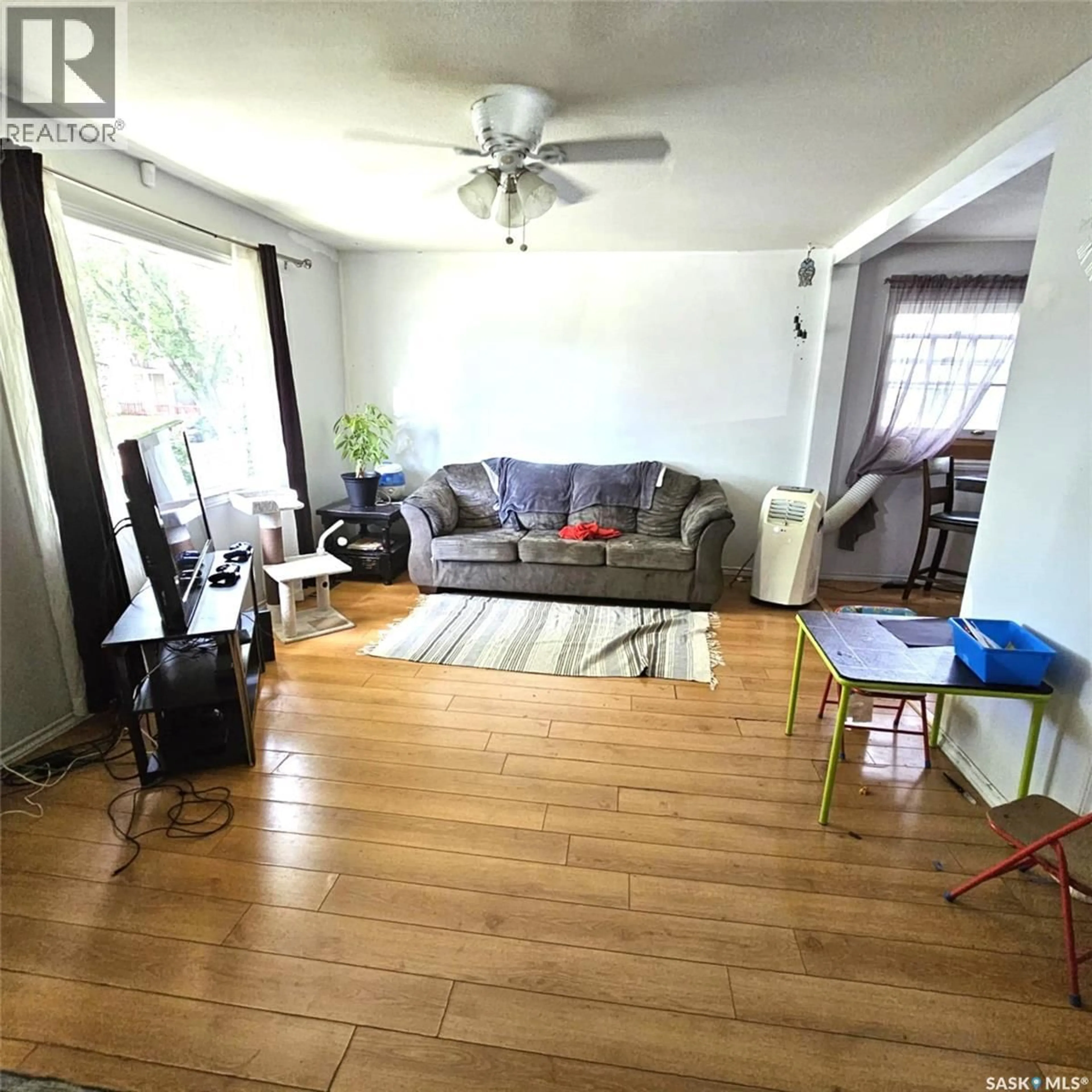 Living room with furniture, wood/laminate floor for 1261 ATKINSON STREET, Regina Saskatchewan S4N3V7