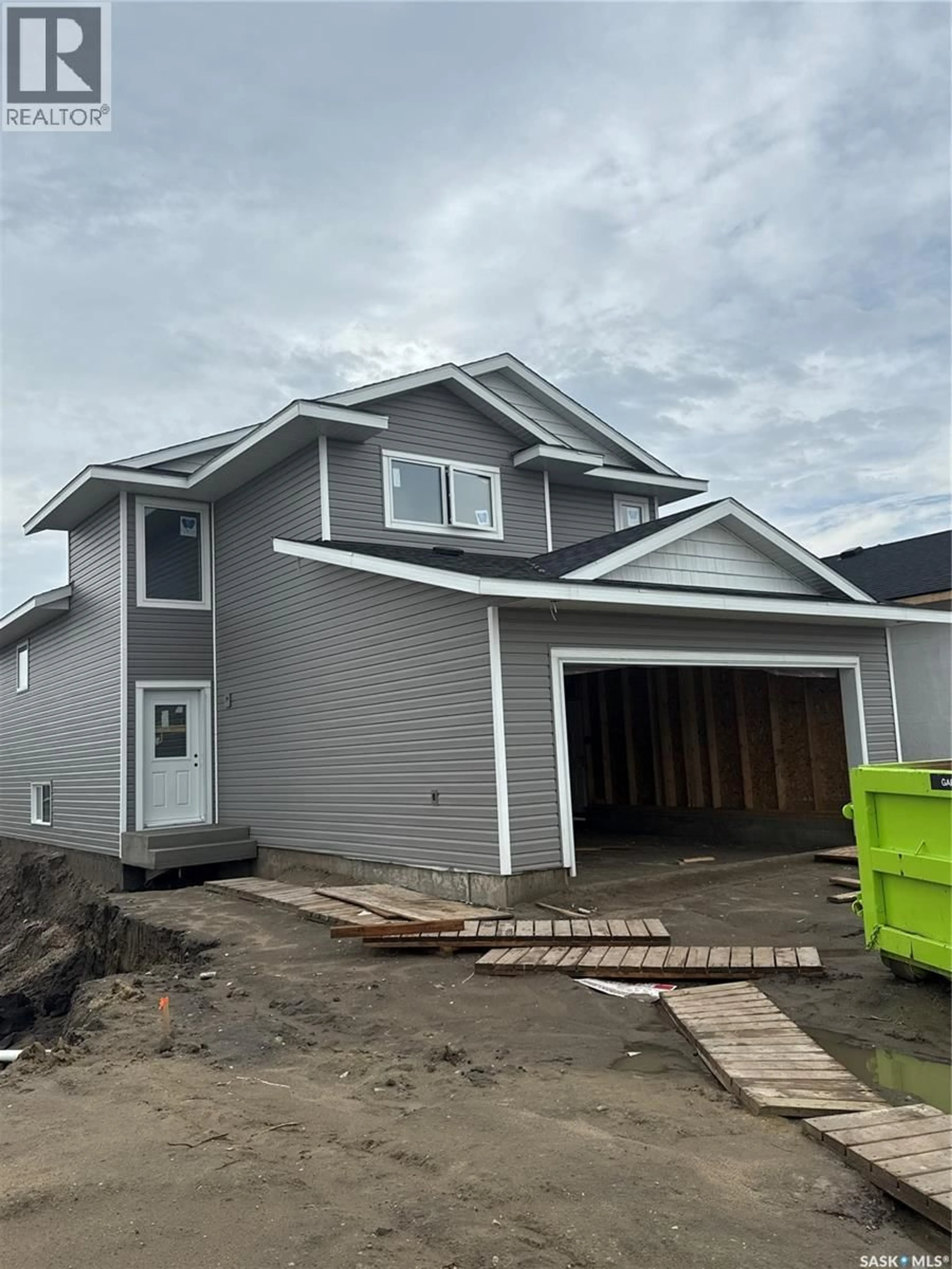 Home with vinyl exterior material, street for 233 FROESE CRESCENT, Warman Saskatchewan S0K4S0