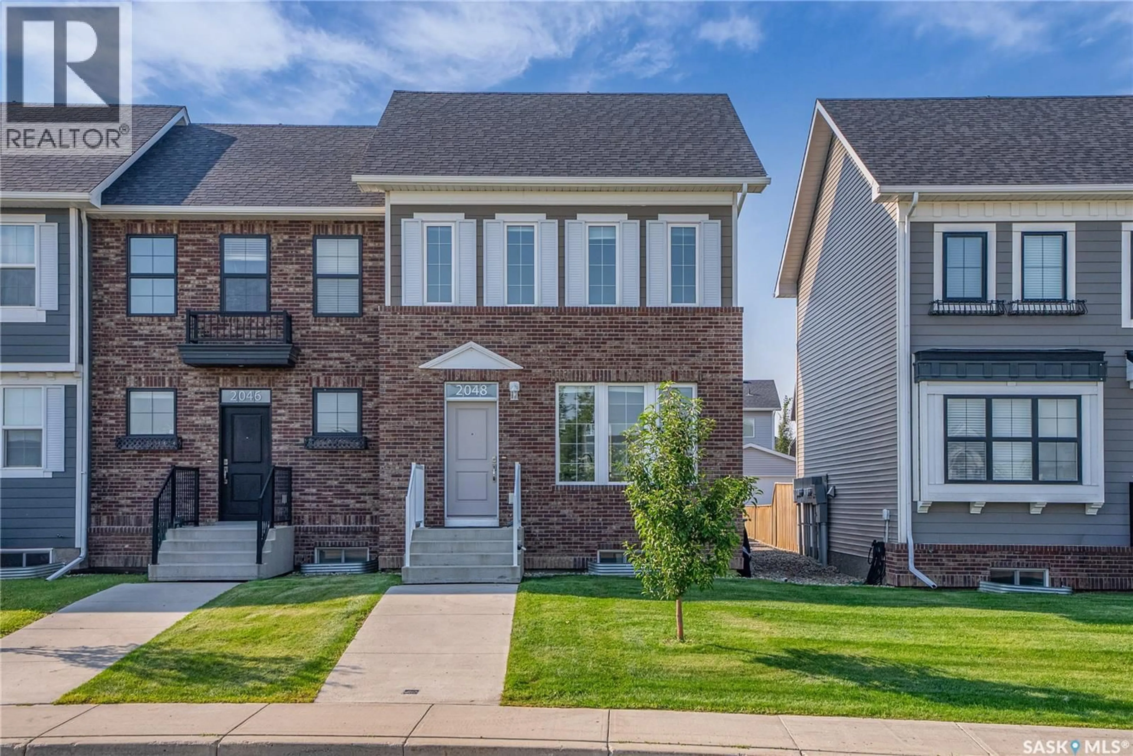Home with brick exterior material, street for 2048 BRIGHTON COMMON, Saskatoon Saskatchewan S7V0N9