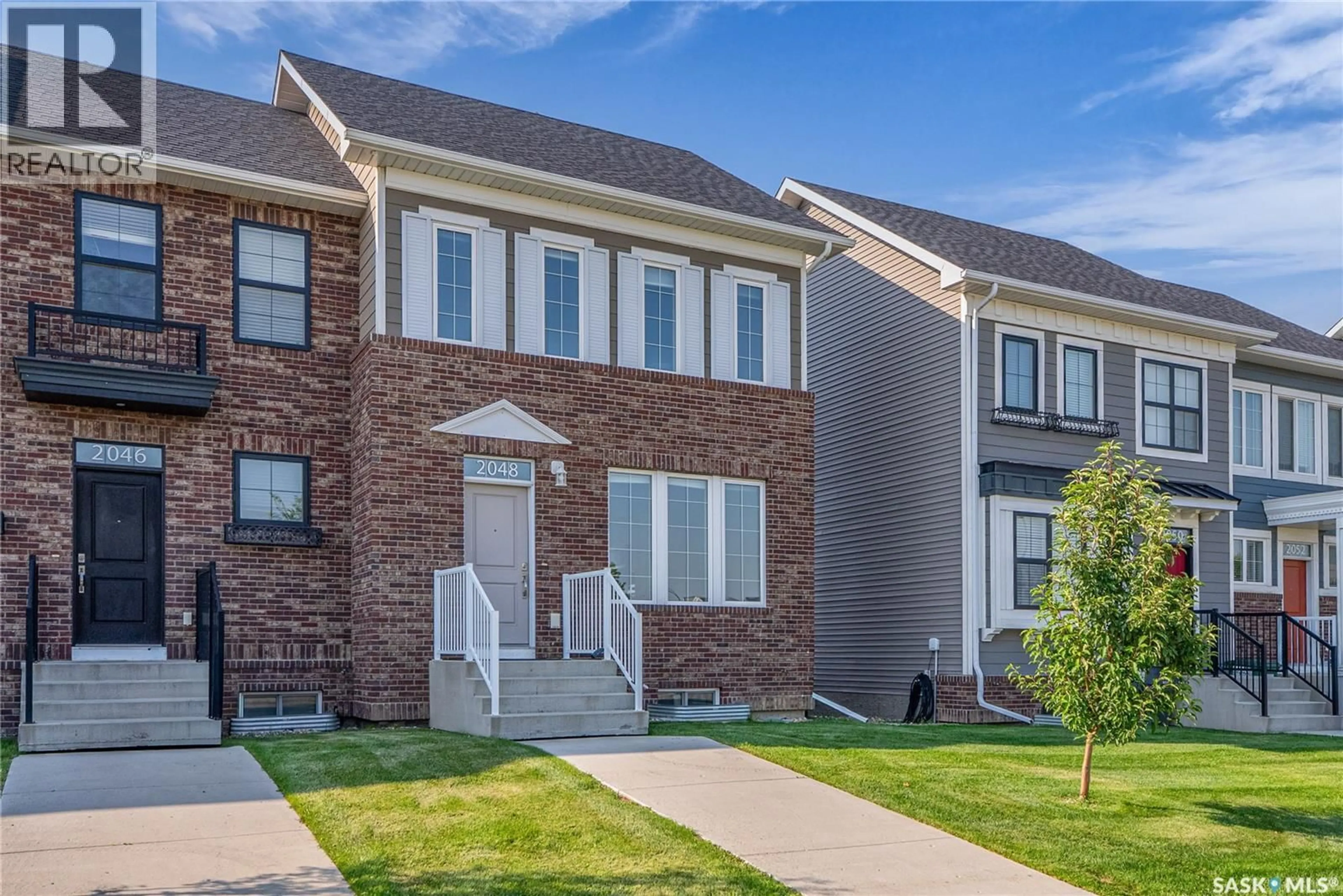 Home with brick exterior material, street for 2048 BRIGHTON COMMON, Saskatoon Saskatchewan S7V0N9