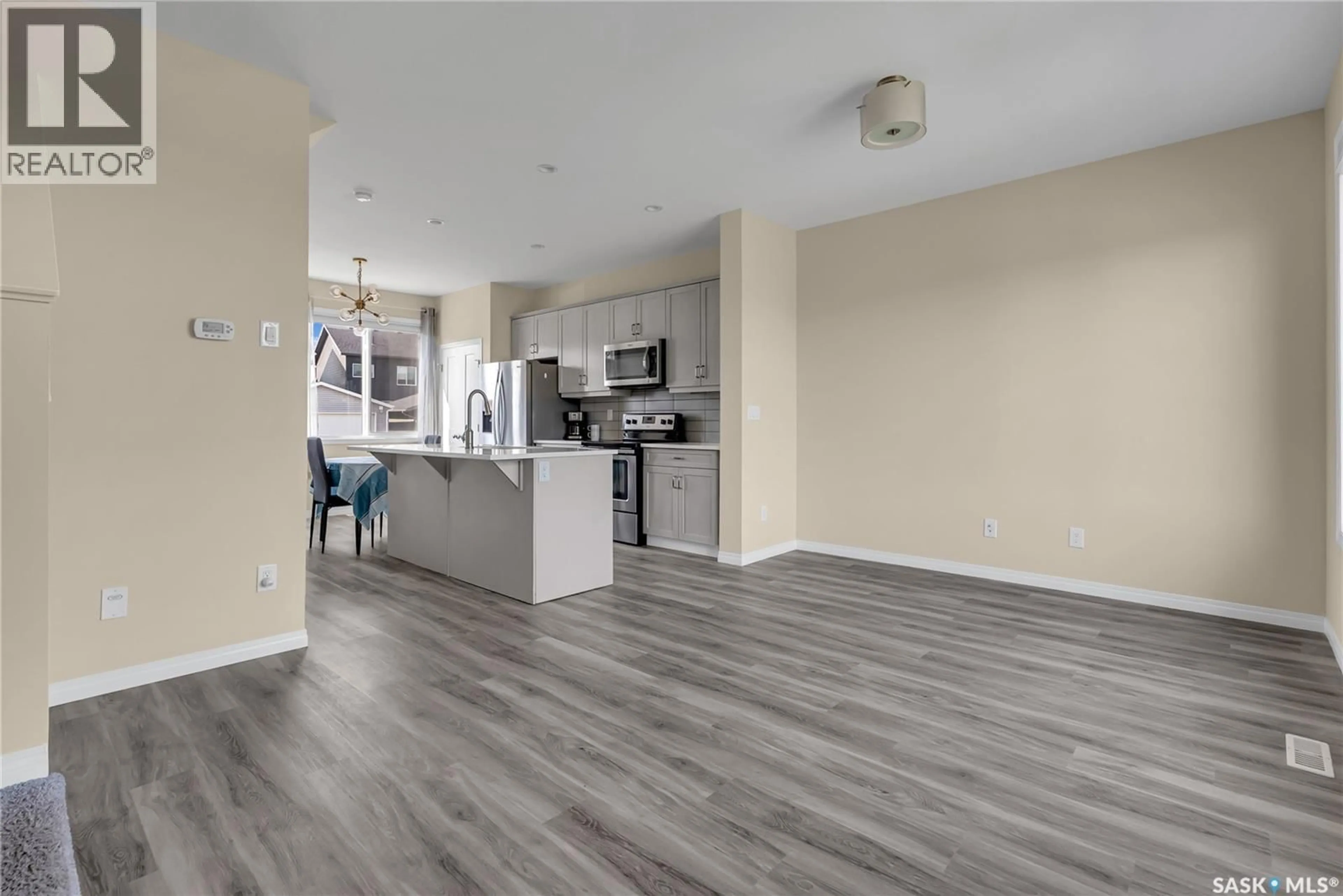 Open concept kitchen, wood/laminate floor for 2048 BRIGHTON COMMON, Saskatoon Saskatchewan S7V0N9