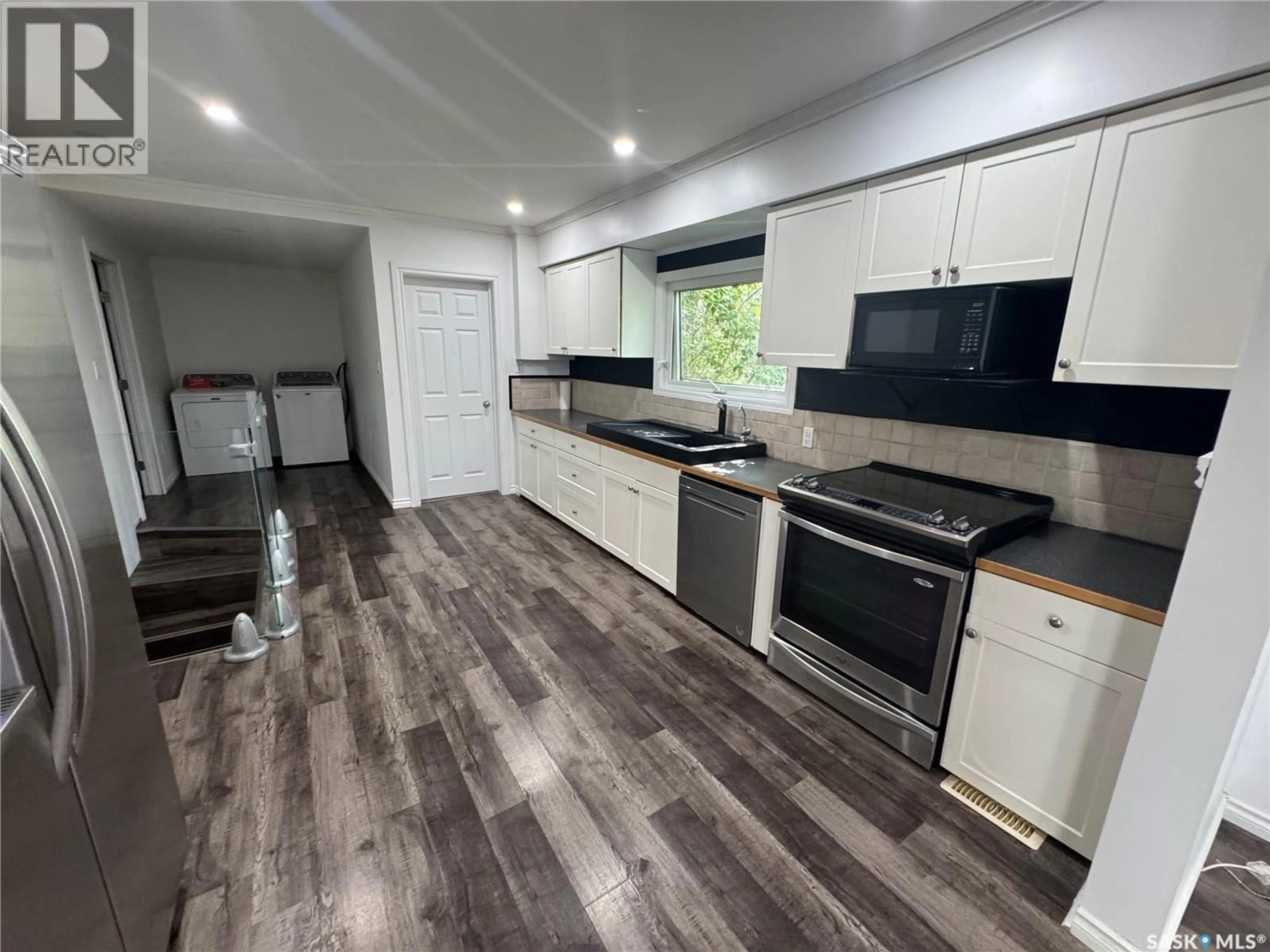 Open concept kitchen, wood/laminate floor for 224 SERVICE ROAD, Norquay Saskatchewan S0A2V0